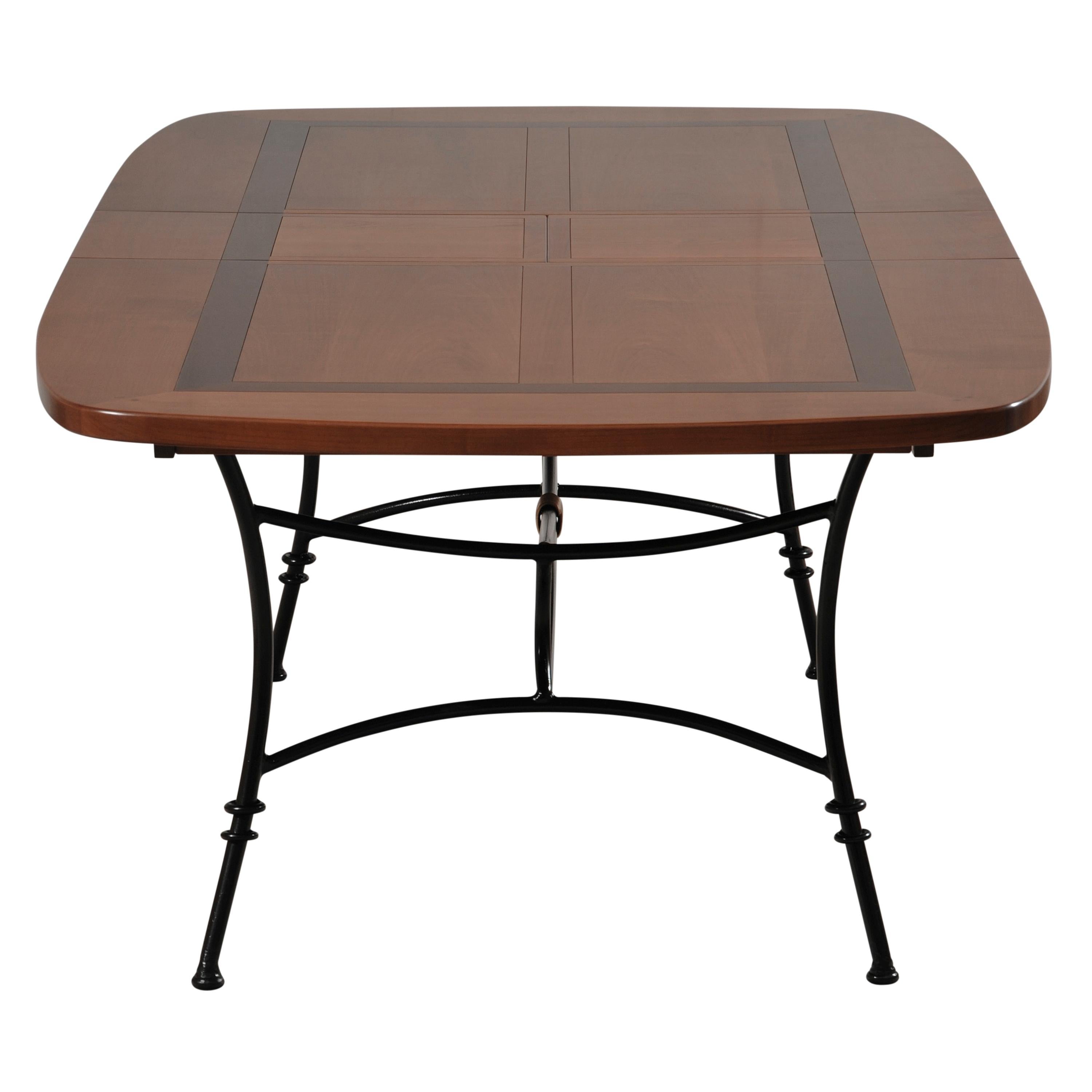 https://a.1stdibscdn.com/wrought-iron-table-with-solid-cherry-top-integrated-extensions-for-sale-picture-5/f_57342/f_404705721720088030313/MEL_5703MDN_Table_ovalis_e_merisier_D_et_cadre_noir_face_1_allonge_3000x3000_master.jpg