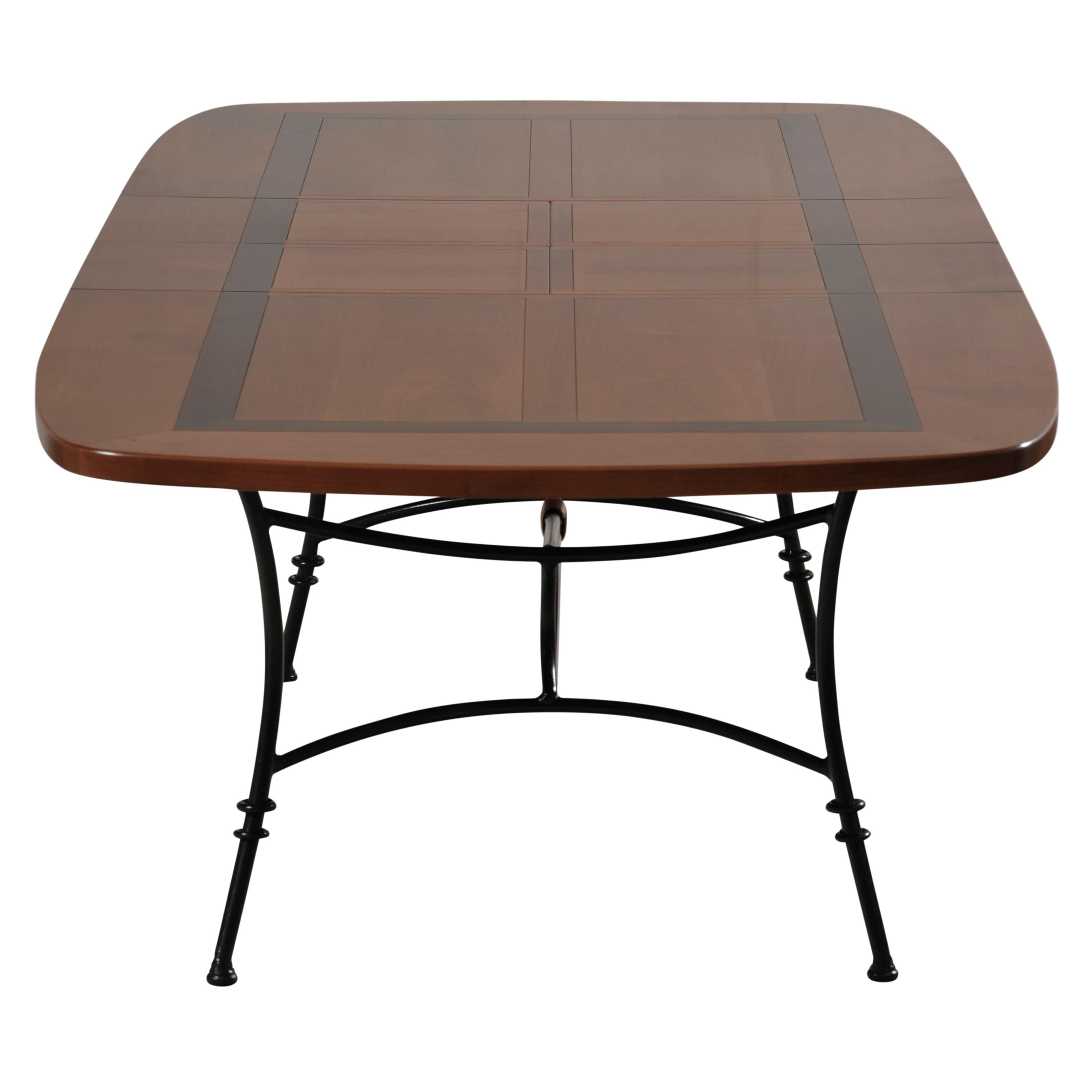https://a.1stdibscdn.com/wrought-iron-table-with-solid-cherry-top-integrated-extensions-for-sale-picture-4/f_57342/f_404705721720088103600/MEL_5703MDN_Table_ovalis_e_merisier_D_et_cadre_noir_face_2_allonges_3000x3000_master.jpg