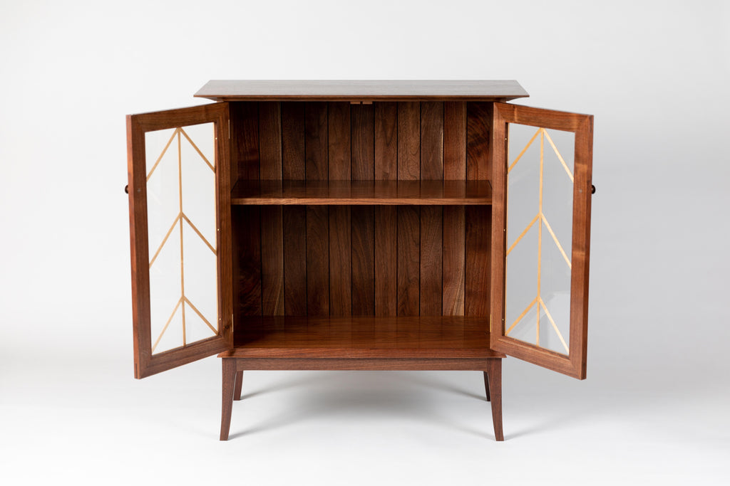 https://a.1stdibscdn.com/contemporary-walnut-cabinet-with-glass-doors-and-butternut-details-for-sale-picture-2/f_38643/1571942182933/MMH20191001_01_master.jpg