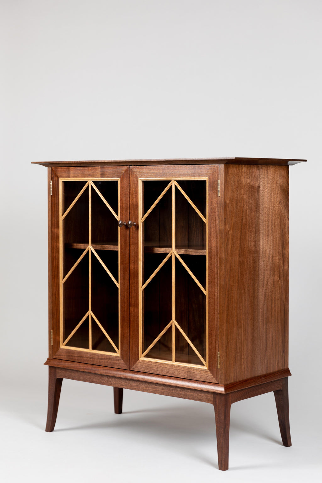 https://a.1stdibscdn.com/contemporary-walnut-cabinet-with-glass-doors-and-butternut-details-for-sale-picture-3/f_38643/1571942198183/MMH20191001_03_master.jpg