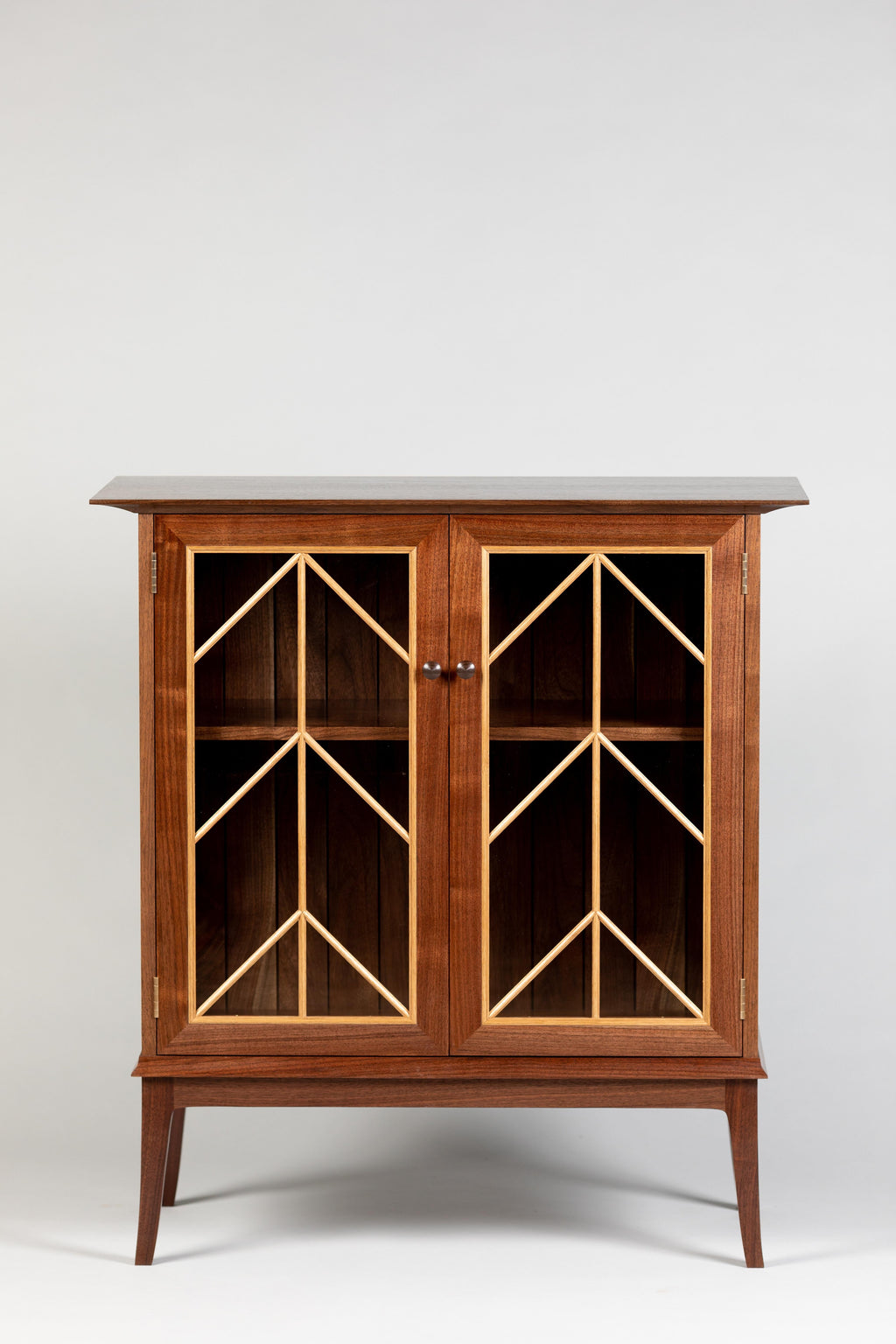 https://a.1stdibscdn.com/contemporary-walnut-cabinet-with-glass-doors-and-butternut-details-for-sale-picture-5/f_38643/1571942210200/MMH20191001_06_master.jpg
