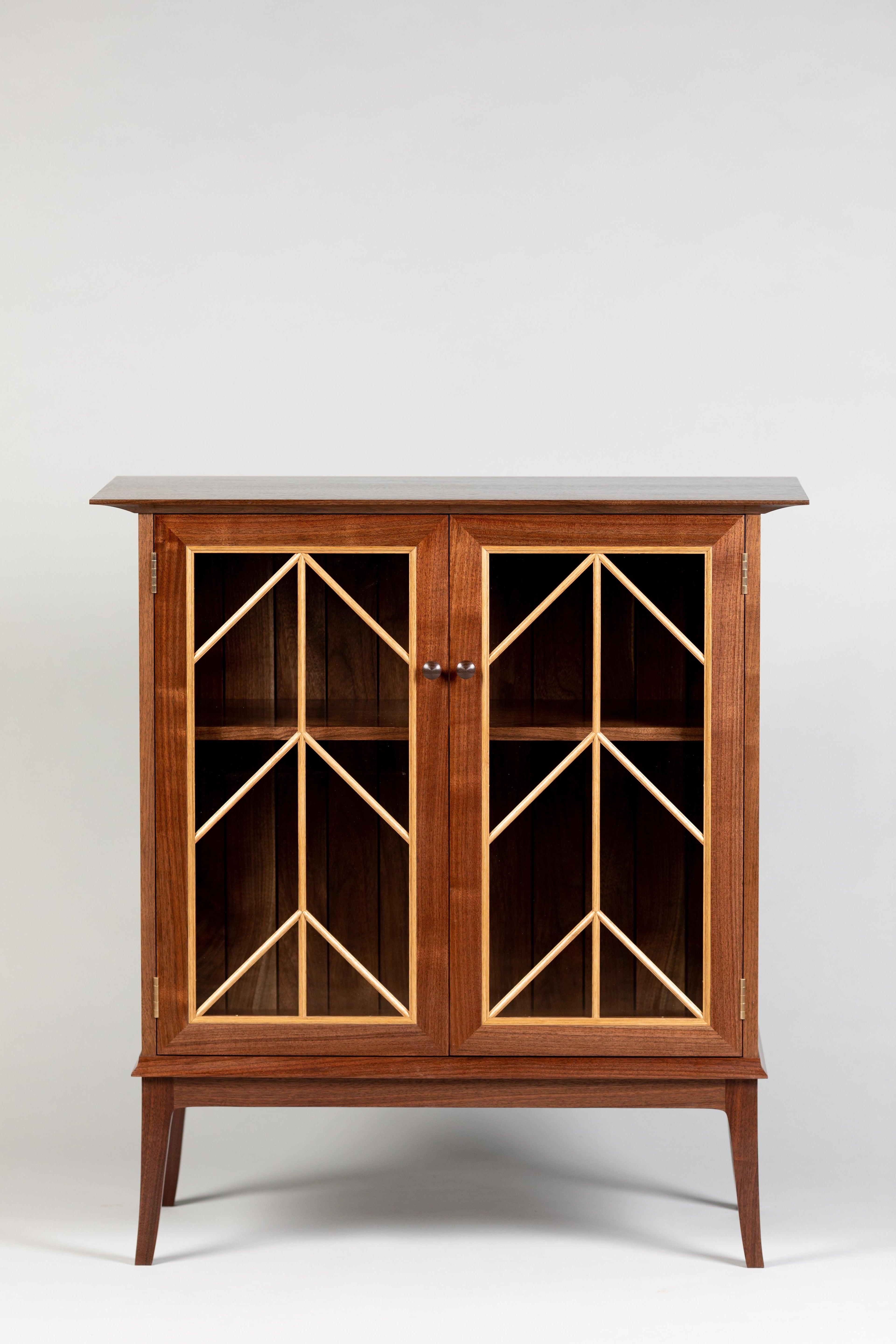 https://a.1stdibscdn.com/contemporary-walnut-cabinet-with-glass-doors-and-butternut-details-for-sale-picture-5/f_38643/1571942210200/MMH20191001_06_master.jpg