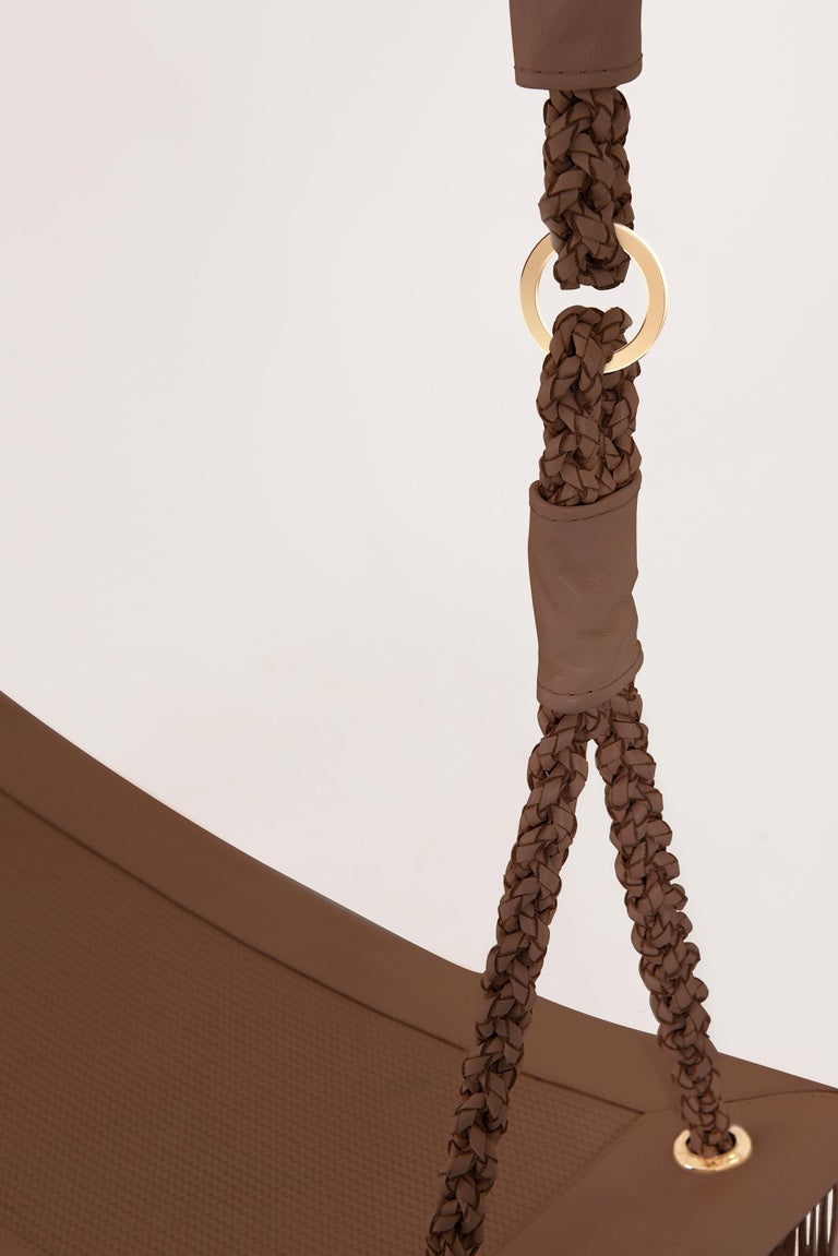 https://a.1stdibscdn.com/revoar-hanging-swing-chair-in-natural-leather-handmade-in-caramel-for-sale-picture-14/f_56842/f_234752921693833319912/Madras_Caramelo_Balan_o_Revoar_Studio_Marta_Manente_5_master.jpg?width=768