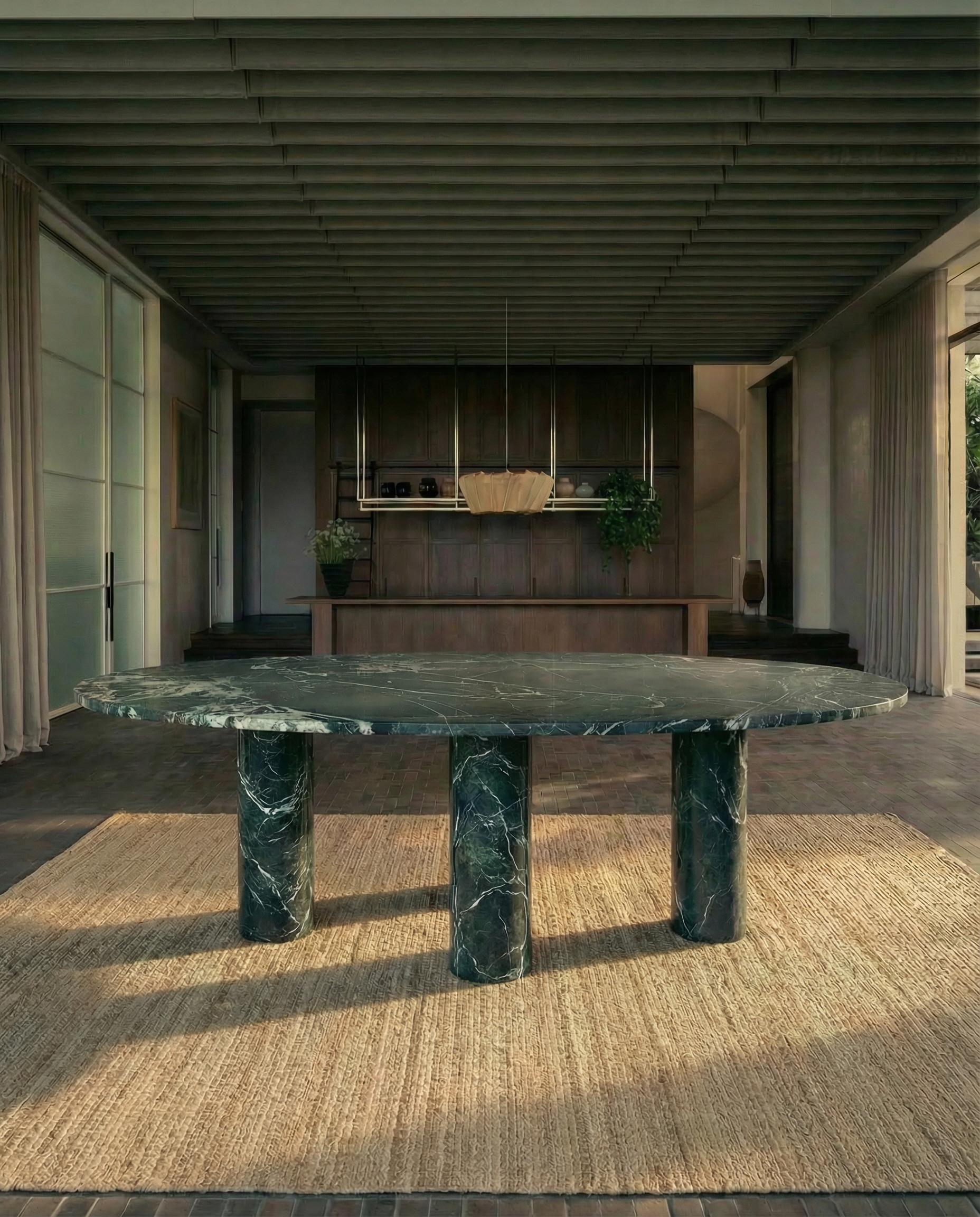 https://a.1stdibscdn.com/large-dark-green-marble-oval-dining-table-with-mario-bellini-style-column-legs-for-sale-picture-2/f_80522/f_491504321773354445072/Mario_Oval_Green_Marble_Dark__master.jpg