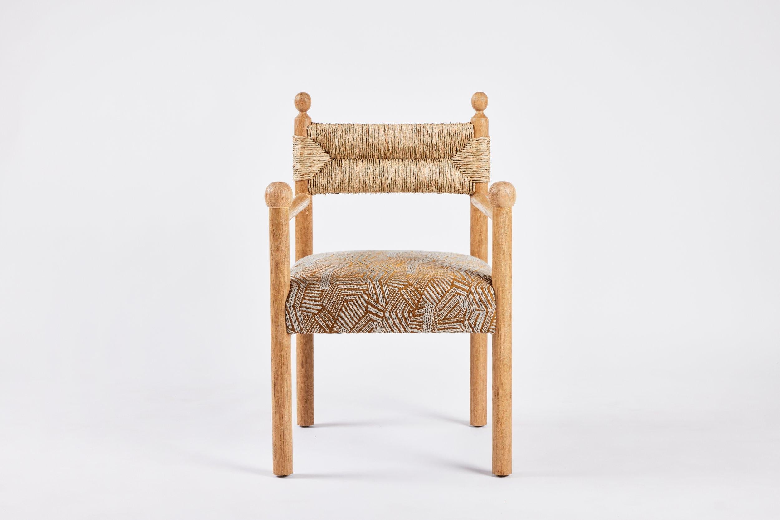 https://a.1stdibscdn.com/rustic-modern-dining-arm-chair-with-turned-finials-upholstered-seat-rush-back-for-sale-picture-2/f_50711/f_373984721701712067343/Martin_and_Brockett_June_2nd_2023_069_master.jpg