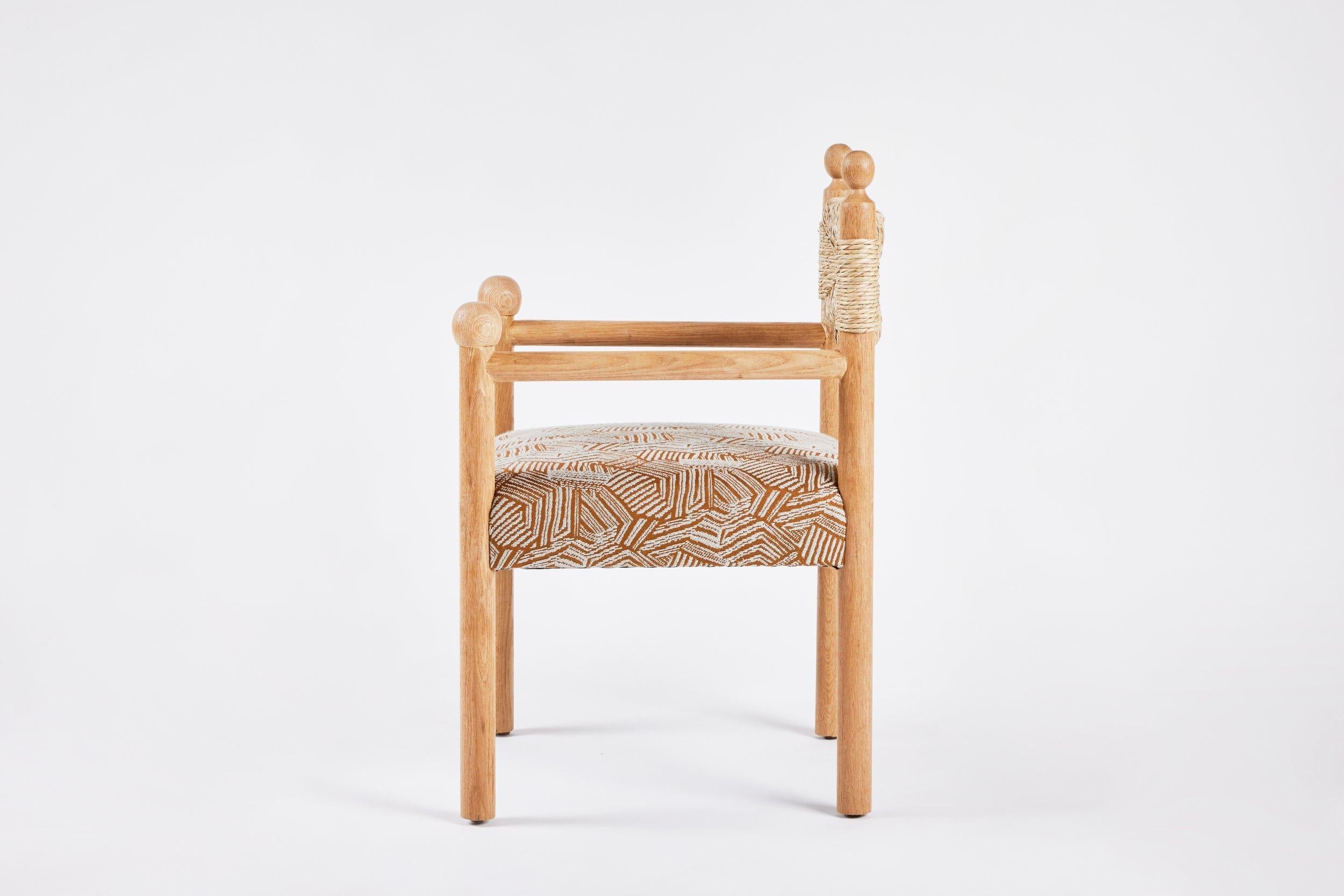 https://a.1stdibscdn.com/rustic-modern-dining-arm-chair-with-turned-finials-upholstered-seat-rush-back-for-sale-picture-3/f_50711/f_373984721701712066912/Martin_and_Brockett_June_2nd_2023_071_master.jpg
