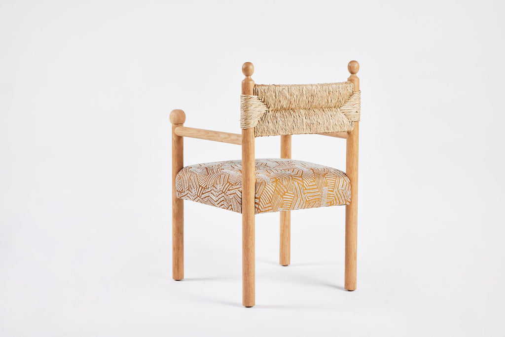 https://a.1stdibscdn.com/rustic-modern-dining-arm-chair-with-turned-finials-upholstered-seat-rush-back-for-sale-picture-4/f_50711/f_373984721701712067463/Martin_and_Brockett_June_2nd_2023_072_master.jpg