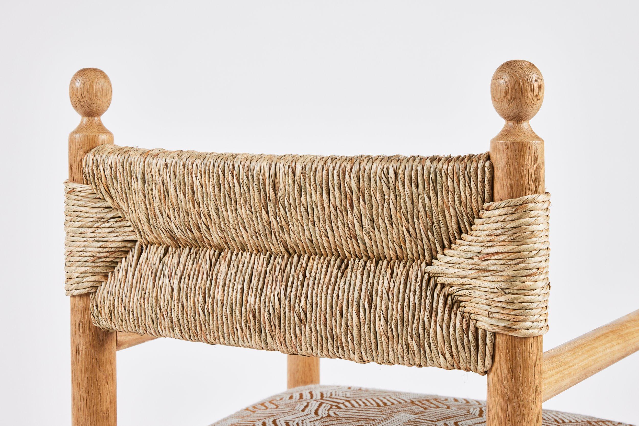 https://a.1stdibscdn.com/rustic-modern-dining-arm-chair-with-turned-finials-upholstered-seat-rush-back-for-sale-picture-6/f_50711/f_373984721701712067995/Martin_and_Brockett_June_2nd_2023_074_master.jpg