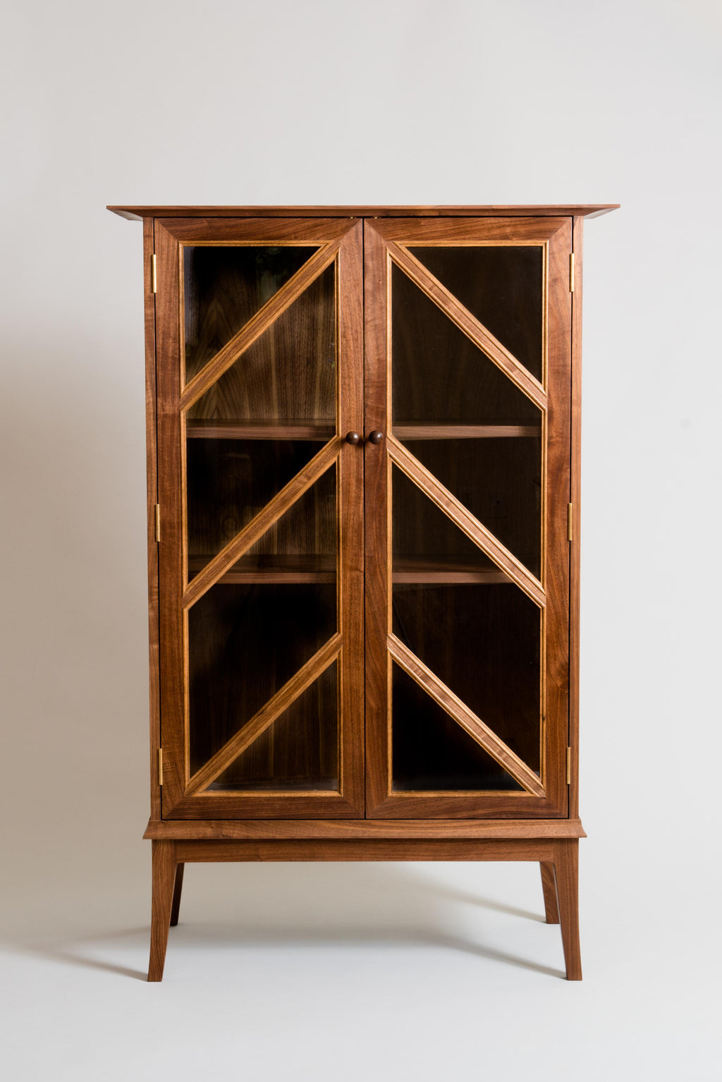 https://a.1stdibscdn.com/tall-contemporary-walnut-cabinet-with-glass-doors-and-butternut-details-for-sale-picture-4/f_38643/f_164999621571241470032/MeredithHartFurnitureCabinet1_master.jpg
