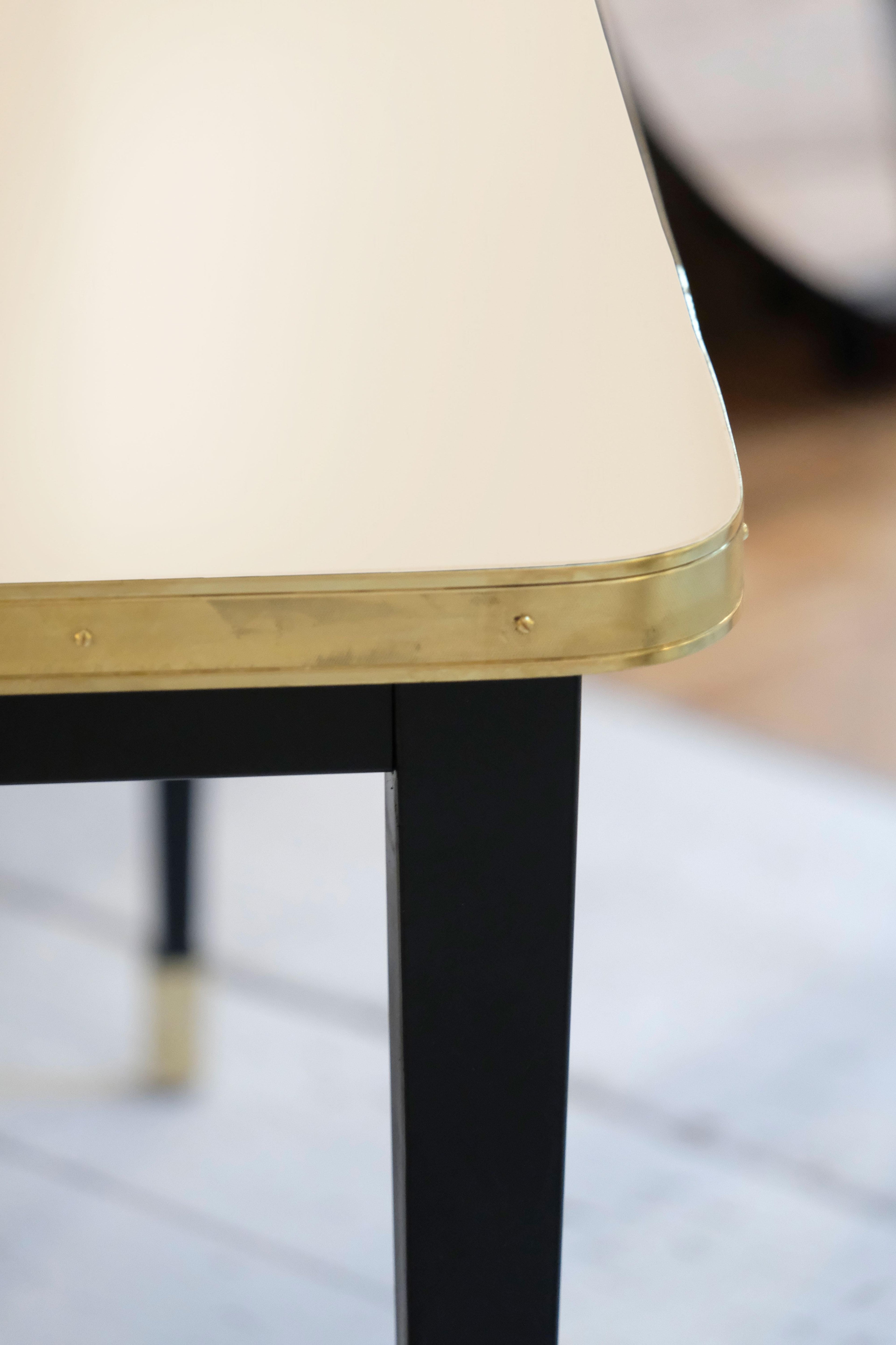 https://a.1stdibscdn.com/rectangular-table-high-gloss-top-brass-framed-black-conic-legs-brass-end-xlarge-for-sale-picture-2/f_40561/f_338247221681550499215/Mesa_Julieta_antique_white_f7932_master.jpg