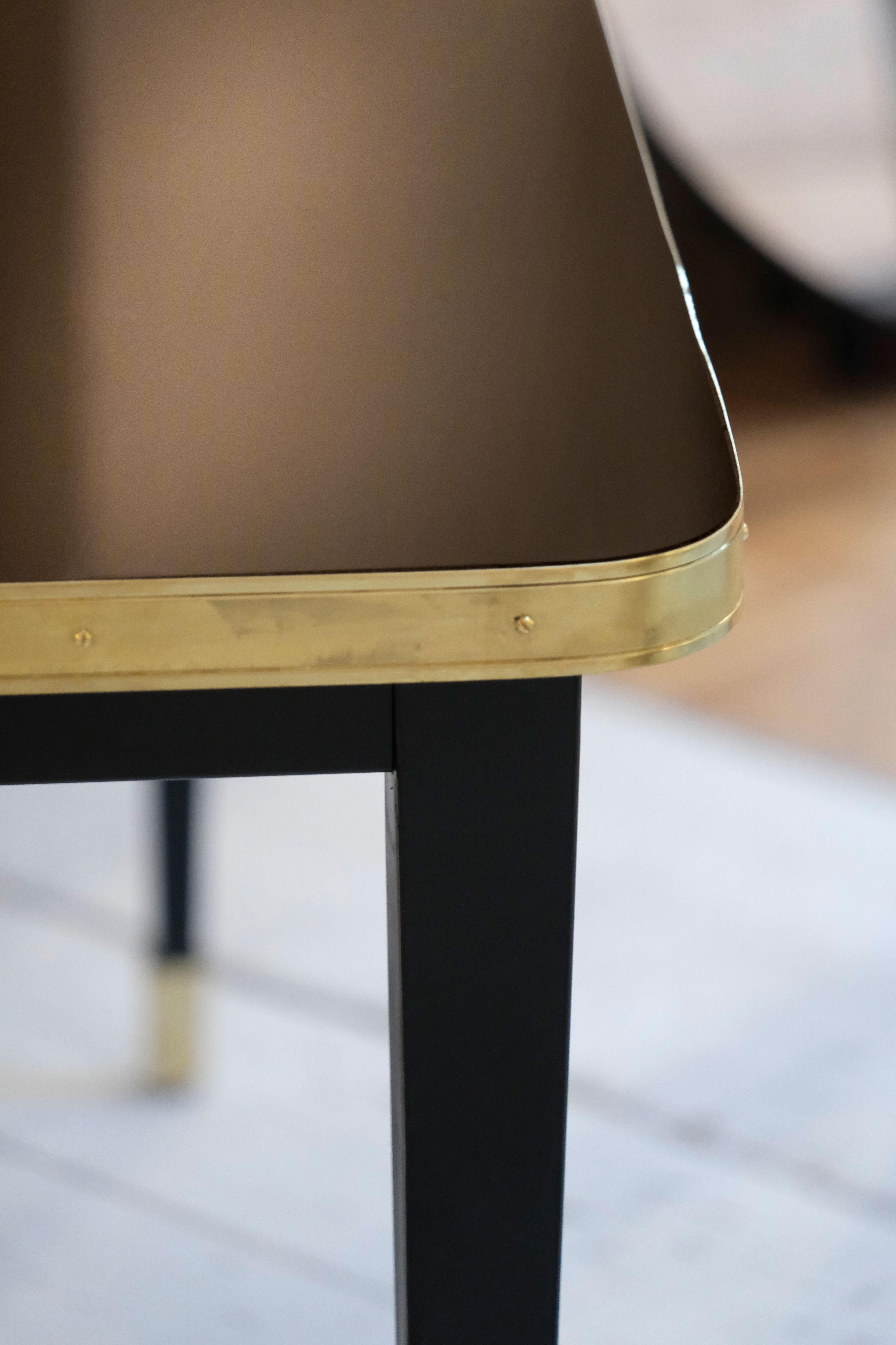 https://a.1stdibscdn.com/rectangular-table-high-gloss-top-brass-framed-black-conic-legs-brass-end-xlarge-for-sale-picture-6/f_40561/f_338247221681550501794/Mesa_Julieta_dark_chocolate_f2200_master.jpg