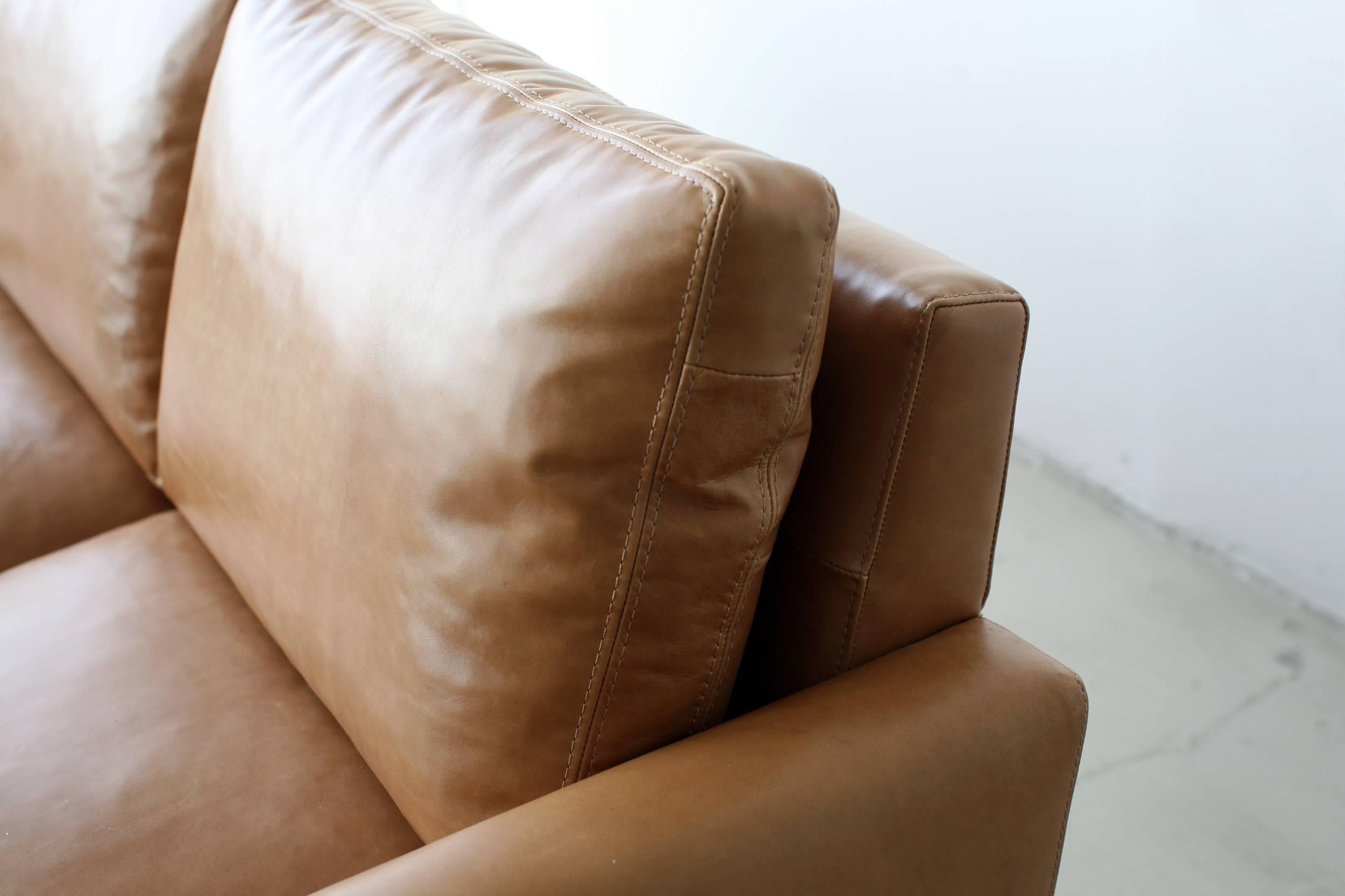 https://a.1stdibscdn.com/contemporary-x-large-standard-sofa-in-caramel-leather-with-walnut-base-for-sale-picture-2/f_29663/f_196154721593055602001/Michael_Felix_Standard_Sofa_side_master.jpg