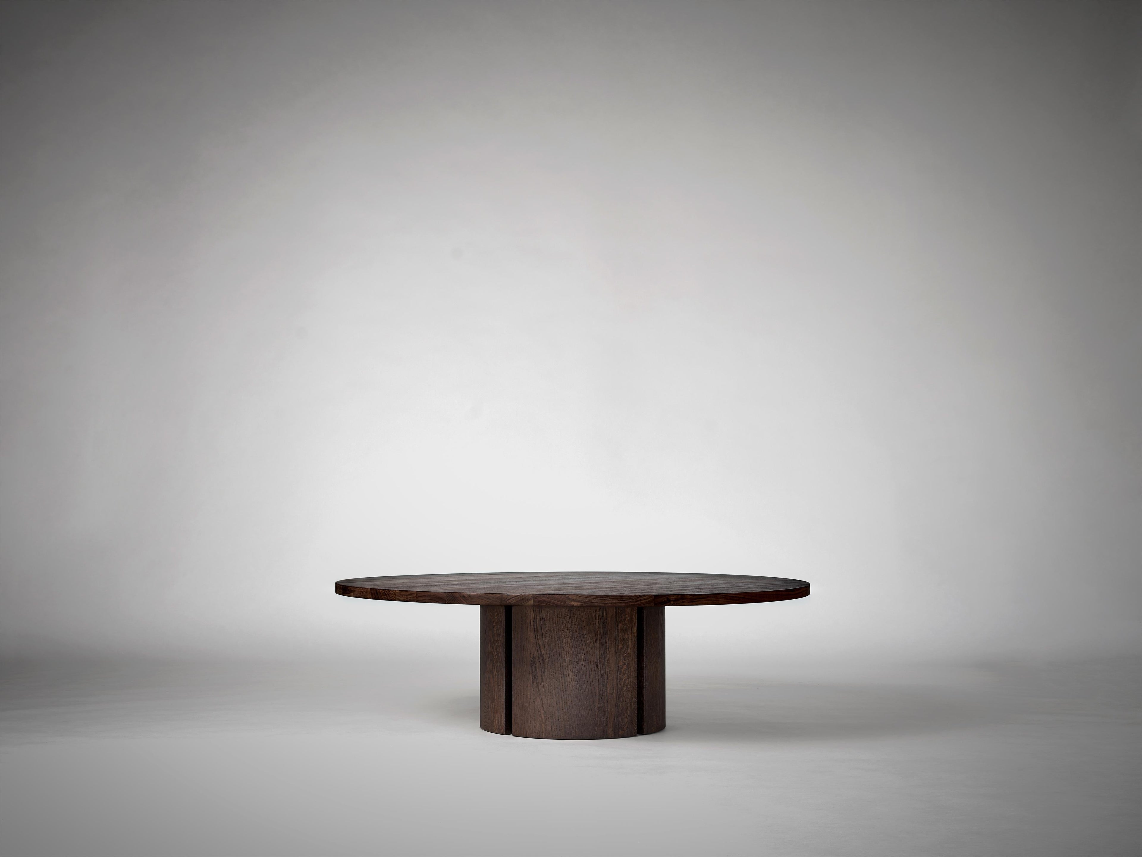 https://a.1stdibscdn.com/round-coffee-table-in-solid-dark-brown-european-oak-aperta-by-mokko-for-sale-picture-2/f_89302/f_464406721756378822446/Mokko_Aperta_Round_Coffee_Table_Dark_Brown_Oak_G1_photo_by_Thomas_van_Schaik_master.jpg