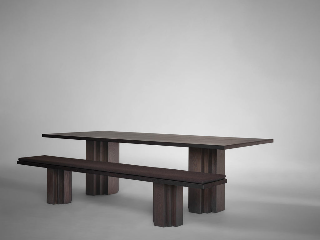 https://a.1stdibscdn.com/large-sculptural-brut-dining-table-solid-oak-for-sale-picture-20/f_89302/f_380659521756377611645/Mokko_Brut_table_Brut_bench_Dark_Brown_Oak_light_grey_side_view_photo_by_Thomas_van_Schaik_master.jpg