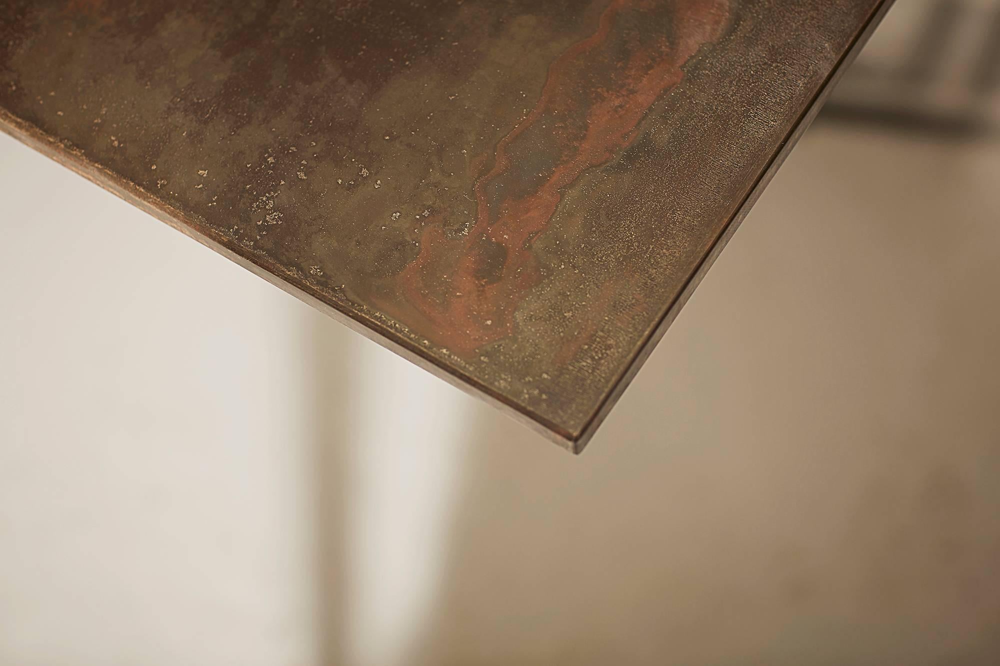 https://a.1stdibscdn.com/athwart-dining-table-patinated-steel-frame-patinated-brass-top-xl-for-sale-picture-5/f_25883/f_335039221679923910856/NOVOCASTRIAN_Athwart_5_WEB_master.jpg