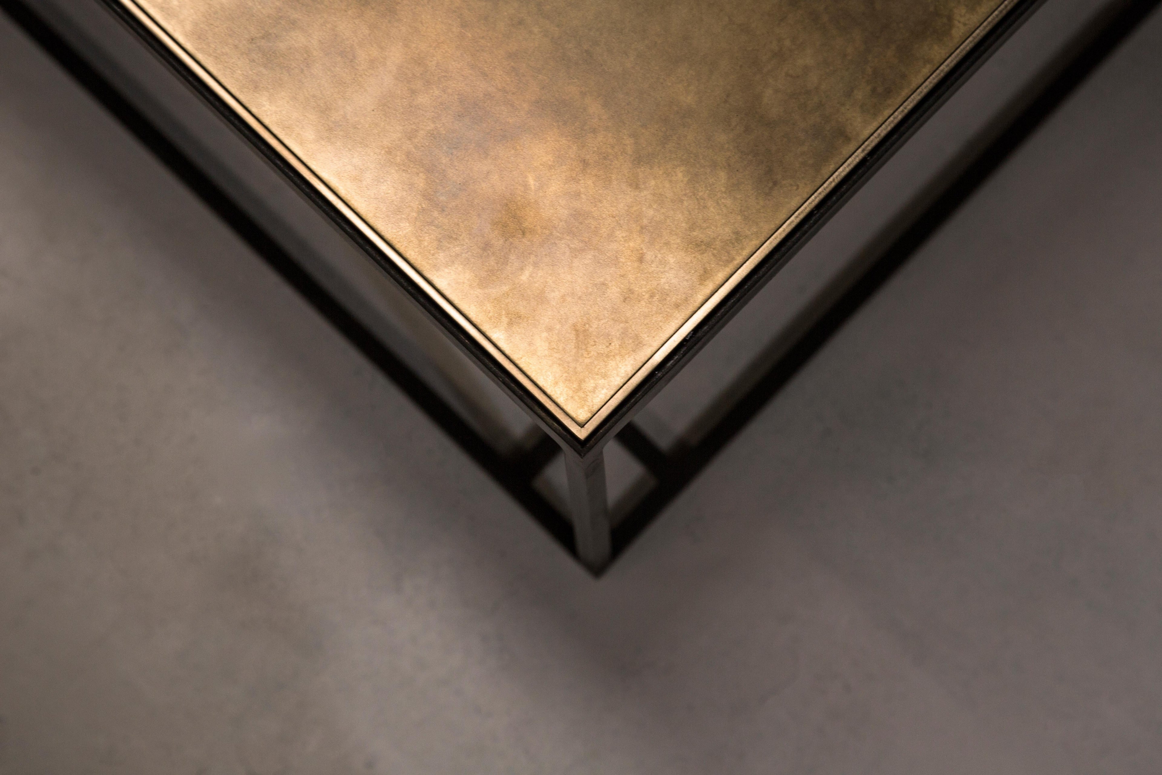 https://a.1stdibscdn.com/binate-coffee-table-extra-large-blackened-steel-frame-patinated-brass-top-for-sale-picture-4/f_25883/f_272126821645089772279/NOVOCASTRIAN_Brass_Binate_Large_5_master.jpg