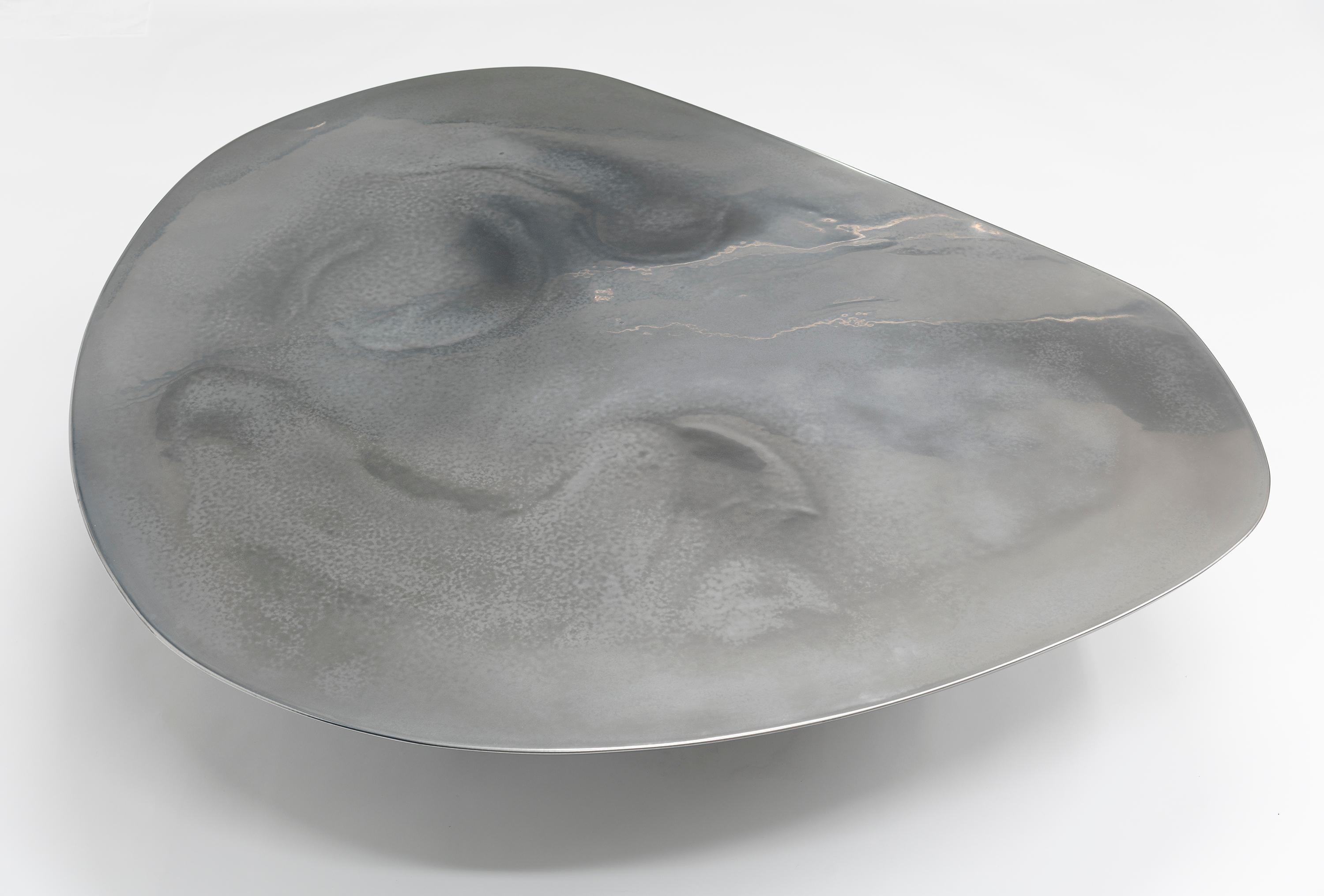 https://a.1stdibscdn.com/nr-low-21st-century-modern-sculptural-circular-silver-black-coffee-table-for-sale-picture-7/f_55762/1613998099909/NR_low_table_1_1_of_1_2_3_Top_master.jpg