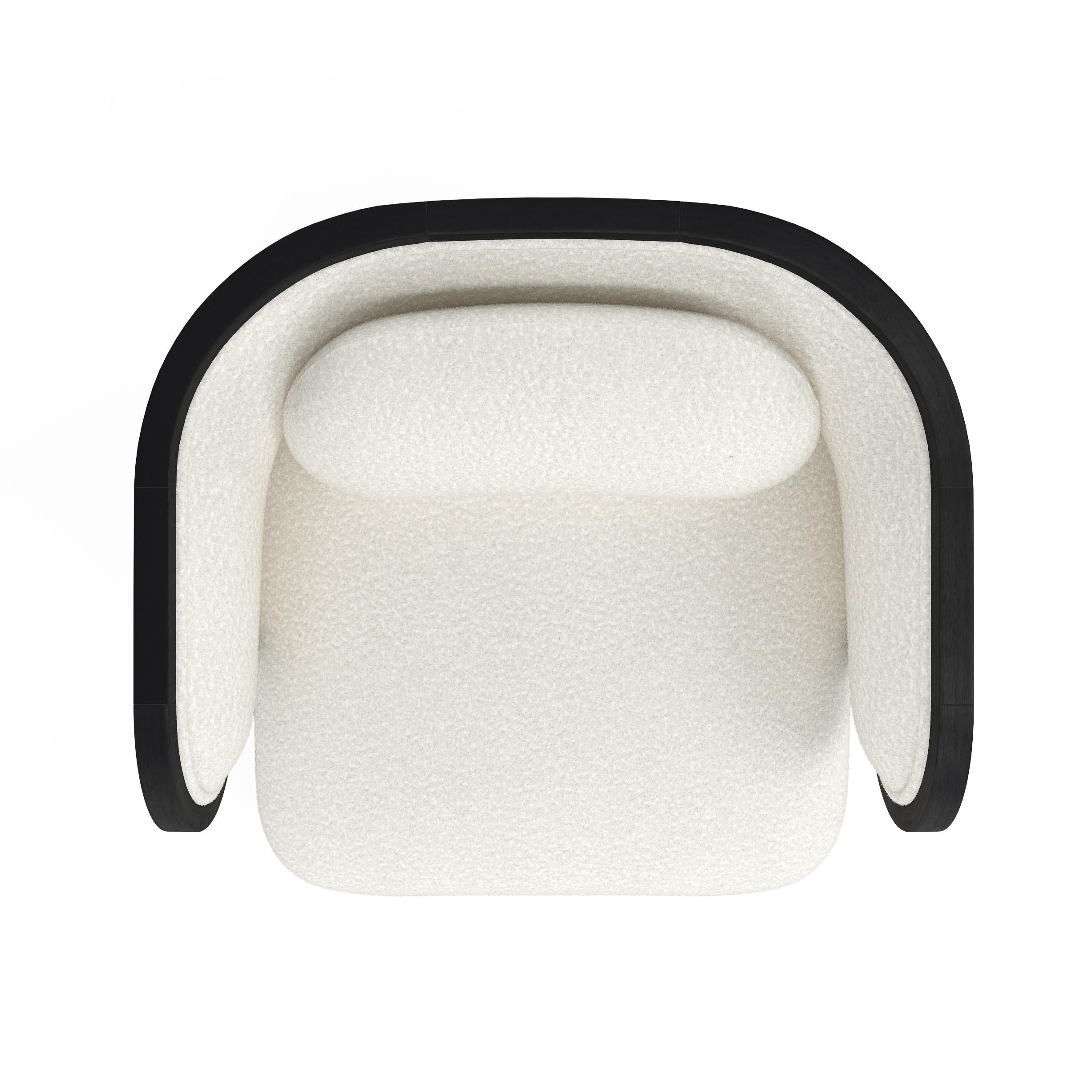 https://a.1stdibscdn.com/odette-curvy-club-chair-with-black-oak-wood-frame-for-sale-picture-4/f_22063/f_274861321645536907203/ODETTEcbw_top_master.jpg