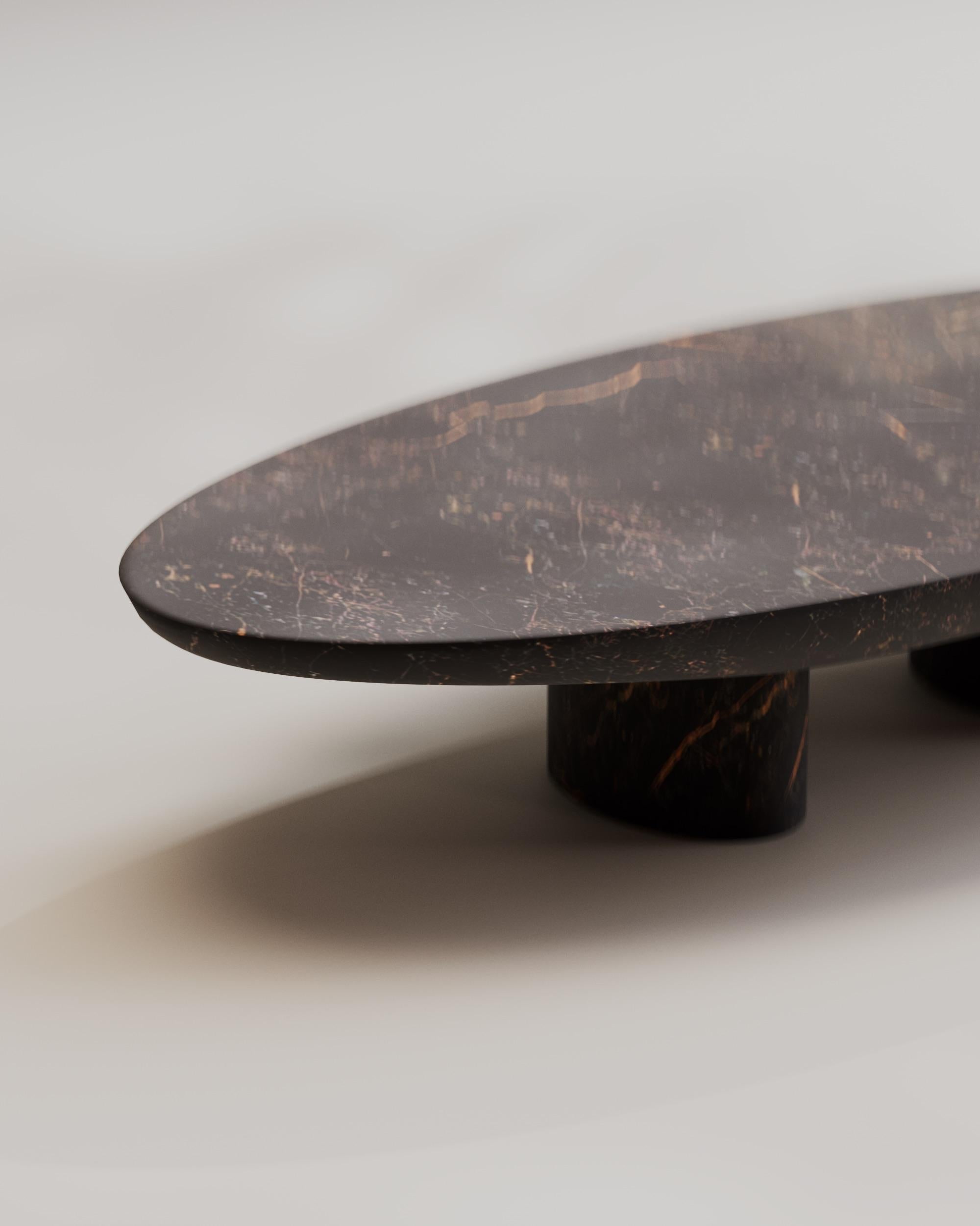 https://a.1stdibscdn.com/solid-port-saint-laurent-abraccio-oval-coffee-table-140-by-studio-narra-for-sale-picture-4/f_70152/f_358443621692885453589/OWN_OBJ_2_12_master.jpeg