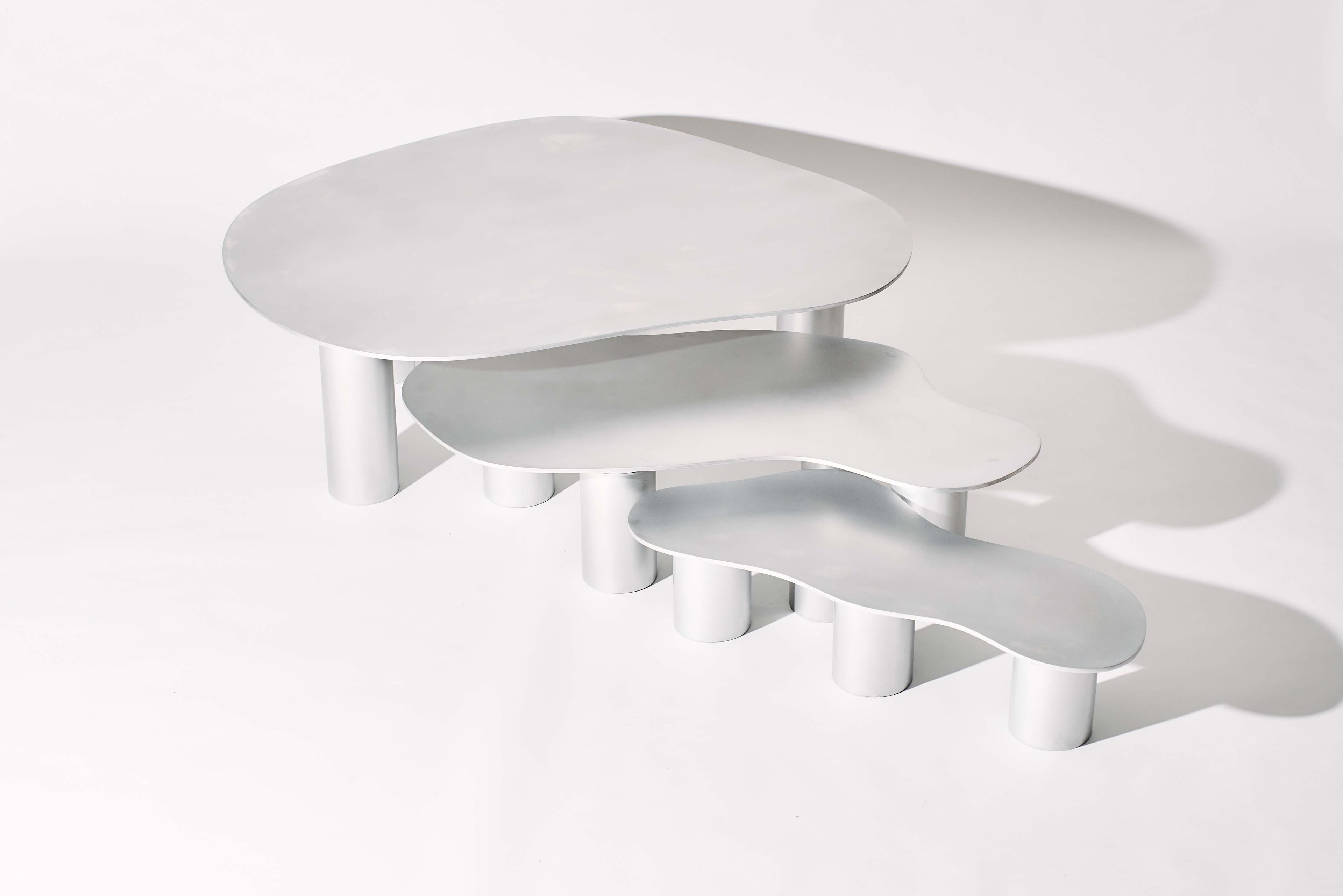 https://a.1stdibscdn.com/the-puddle-table-collection-large-aluminum-coffee-table-with-cylinder-legs-for-sale-picture-7/f_28533/f_398230821743708370351/PUDDLE_SESSION1372_1_1_master.jpg