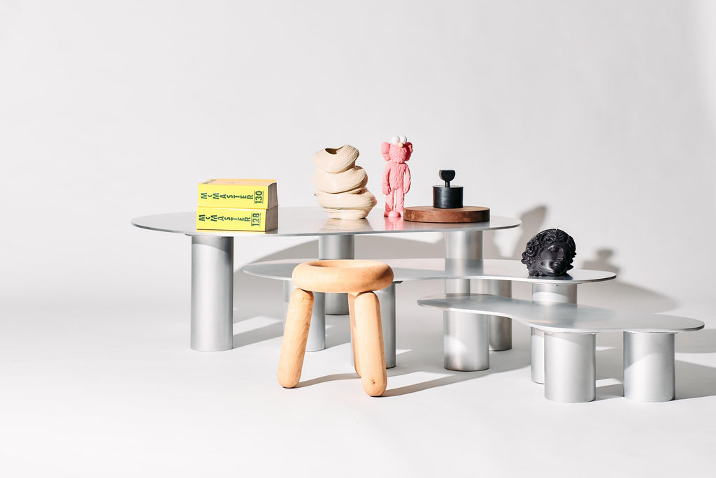 https://a.1stdibscdn.com/the-puddle-table-collection-large-aluminum-coffee-table-with-cylinder-legs-for-sale-picture-5/f_28533/f_398230821716329846113/PUDDLE_SESSION1386_1_master.jpg