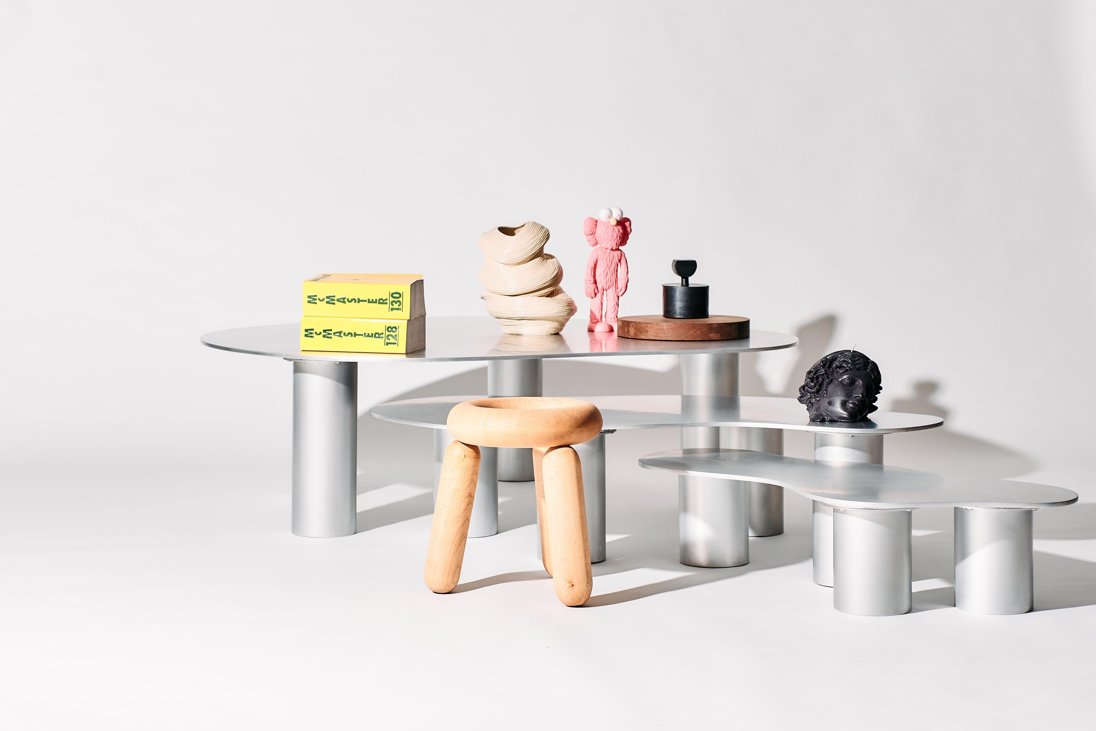 https://a.1stdibscdn.com/the-puddle-table-collection-large-aluminum-coffee-table-with-cylinder-legs-for-sale-picture-5/f_28533/f_398230821716329846113/PUDDLE_SESSION1386_1_master.jpg