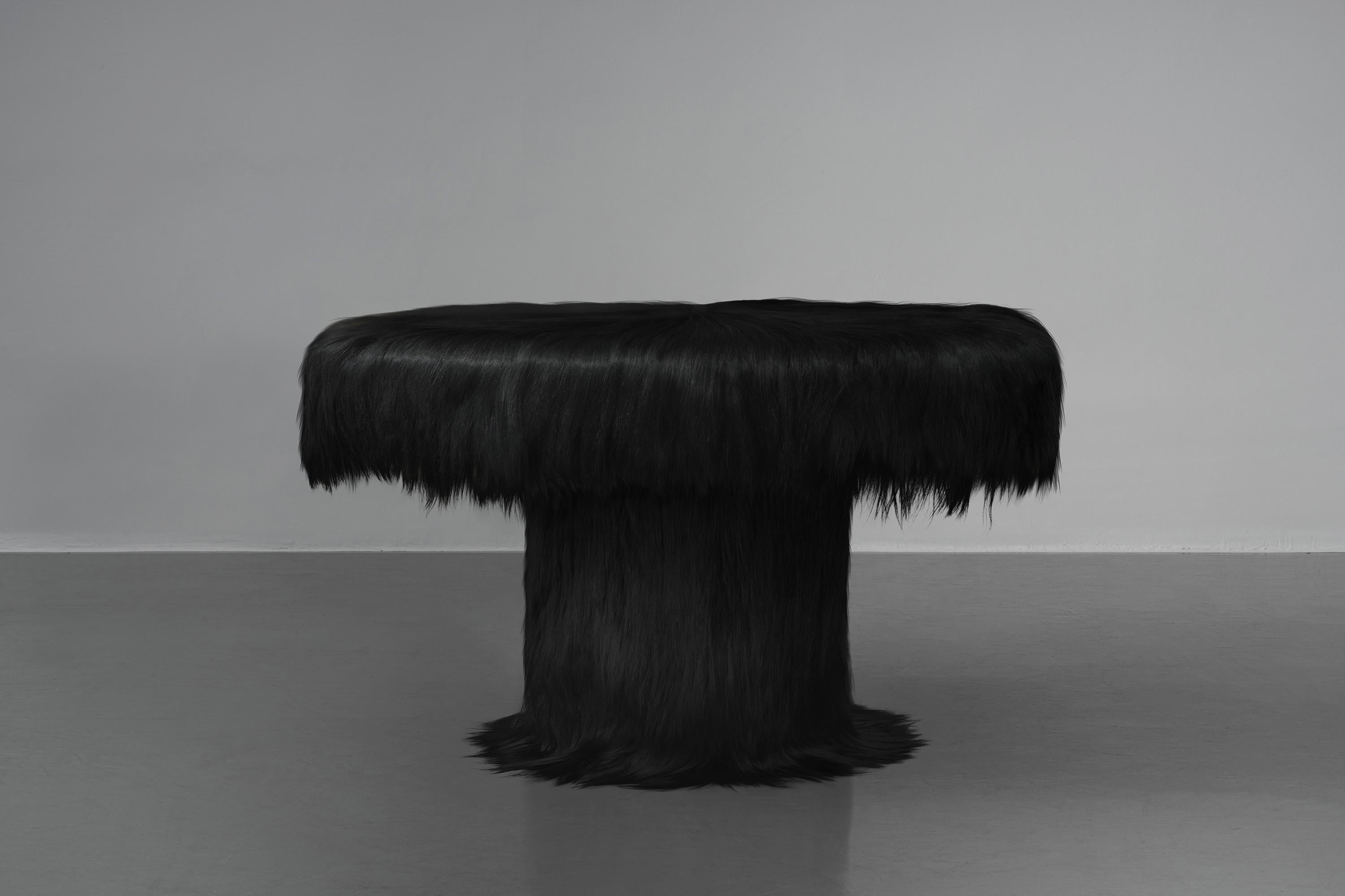 https://a.1stdibscdn.com/black-raw-table-with-furry-goatskin-and-nubuck-by-atelier-vf-for-sale-picture-3/f_70152/f_337756321681323323872/ROG_B_04_table_master.jpg