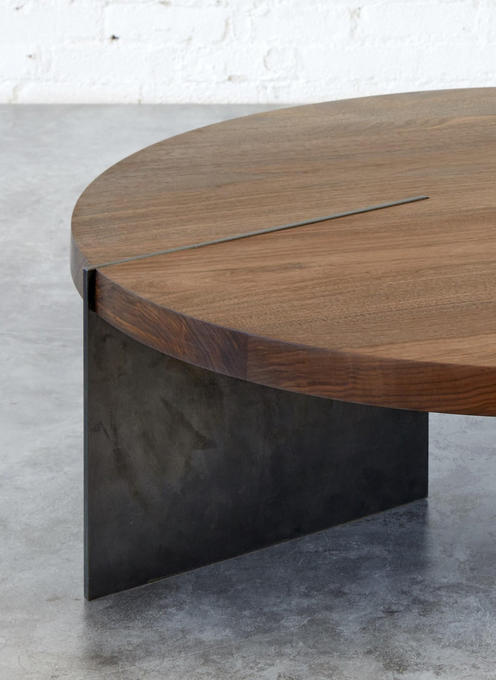 https://a.1stdibscdn.com/reina-round-walnut-coffee-table-with-blackened-steel-base-for-sale-picture-5/f_77532/f_467449421777737976758/Reina_1_Autonomous_cropped_master.jpeg