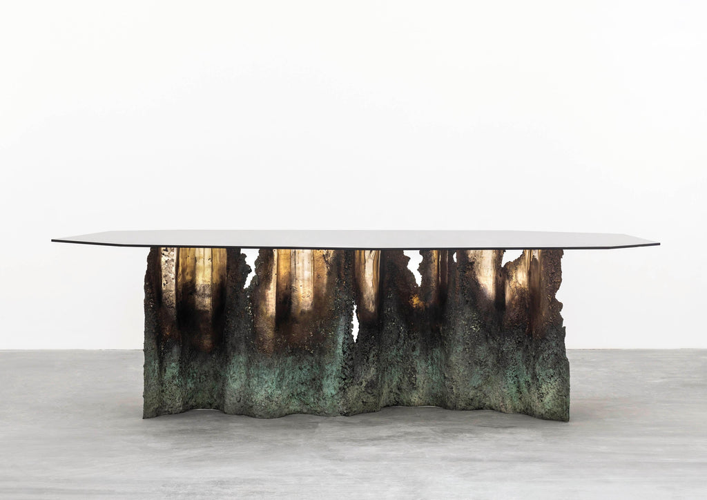 https://a.1stdibscdn.com/turin-dining-table-in-casted-bronze-and-tempered-glass-for-sale-picture-2/f_15712/1623760179151/RobertoSironi_Carwan_Gallery_Ruins33_master.jpg