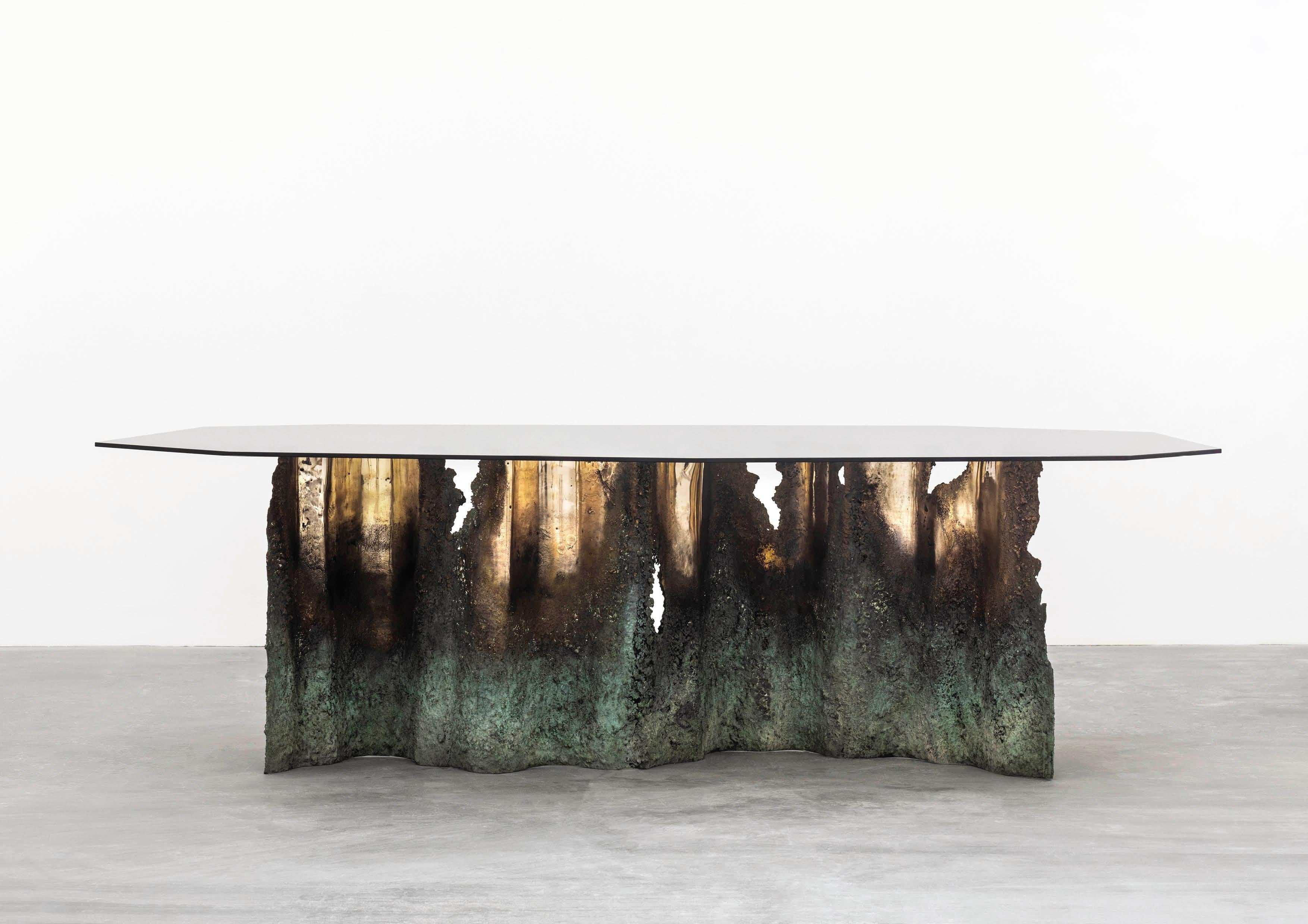 https://a.1stdibscdn.com/turin-dining-table-in-casted-bronze-and-tempered-glass-for-sale-picture-2/f_15712/1623760179151/RobertoSironi_Carwan_Gallery_Ruins33_master.jpg