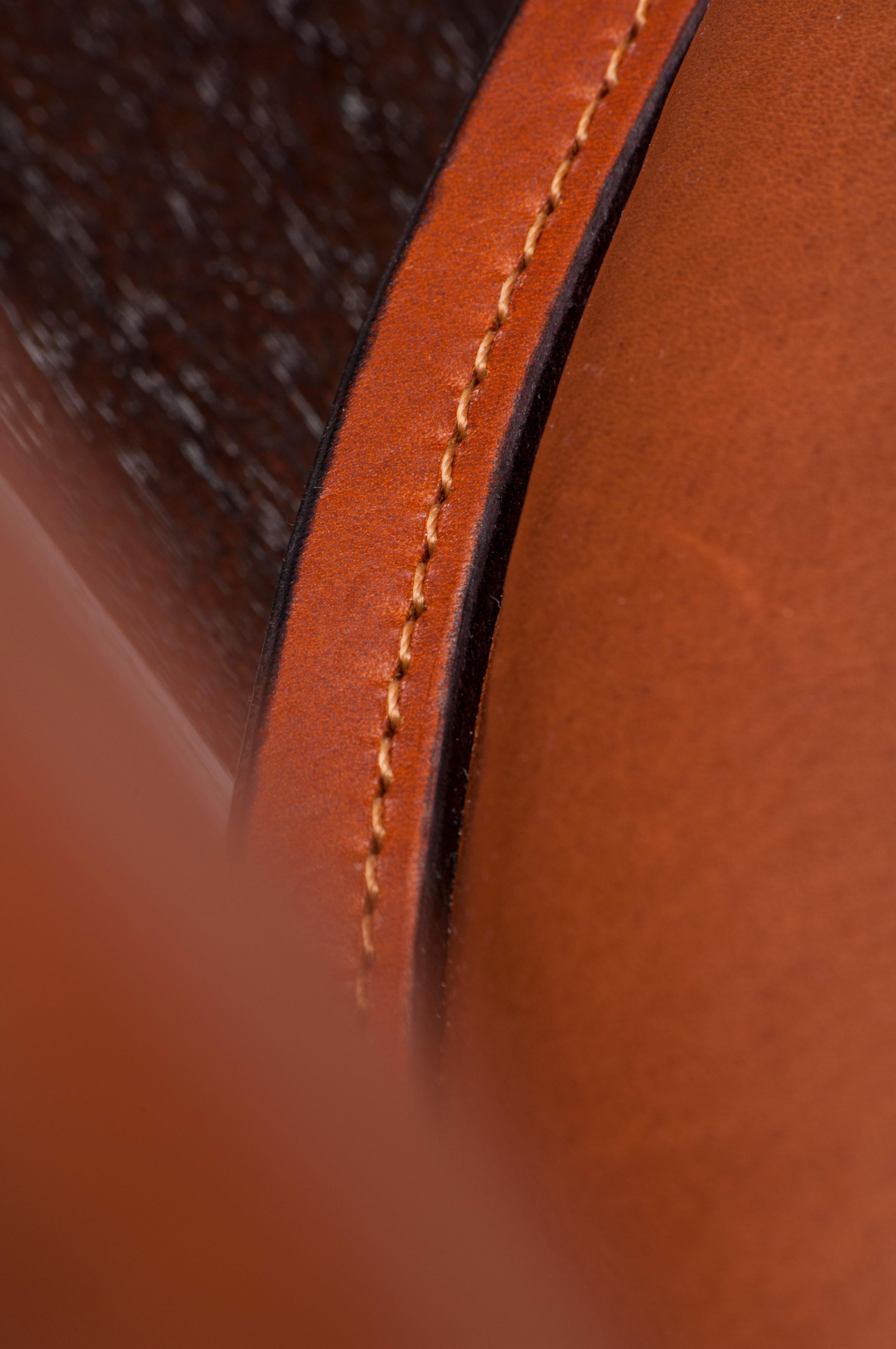 https://a.1stdibscdn.com/contemporary-constructor-armchair-in-tan-saddle-leather-and-solid-walnut-for-sale-picture-5/f_27813/f_136741511550147611751/SS180_master.jpg