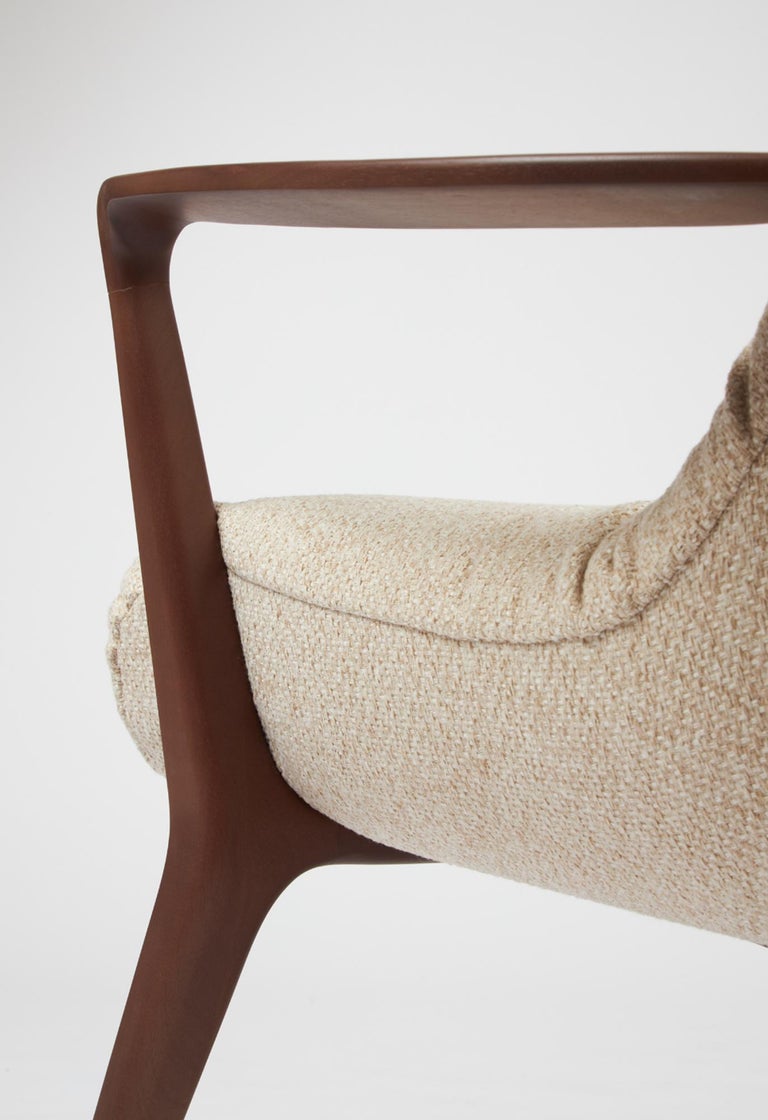 https://a.1stdibscdn.com/minimal-style-insigne-armchair-sculpted-in-walnut-wood-finish-textiles-seating-for-sale-picture-8/f_35593/f_391247321712182114649/Screenshot_2024_04_03_at_19_05_31_master.jpg?width=768