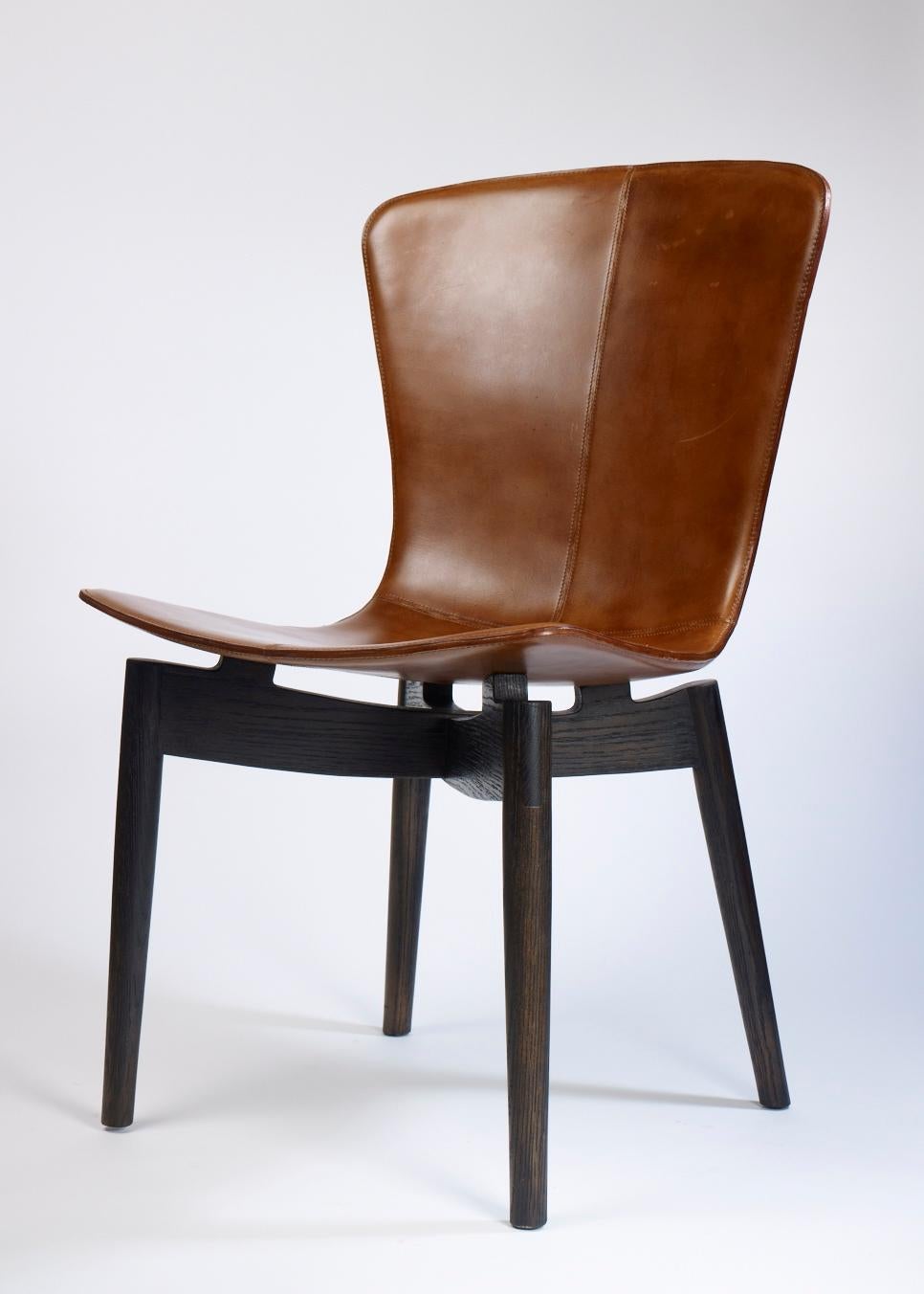 https://a.1stdibscdn.com/shell-chair-leather-upholstery-and-wood-base-for-sale-picture-2/f_71162/f_307570421665183810722/Shell_chair_v00001_o_master.jpg