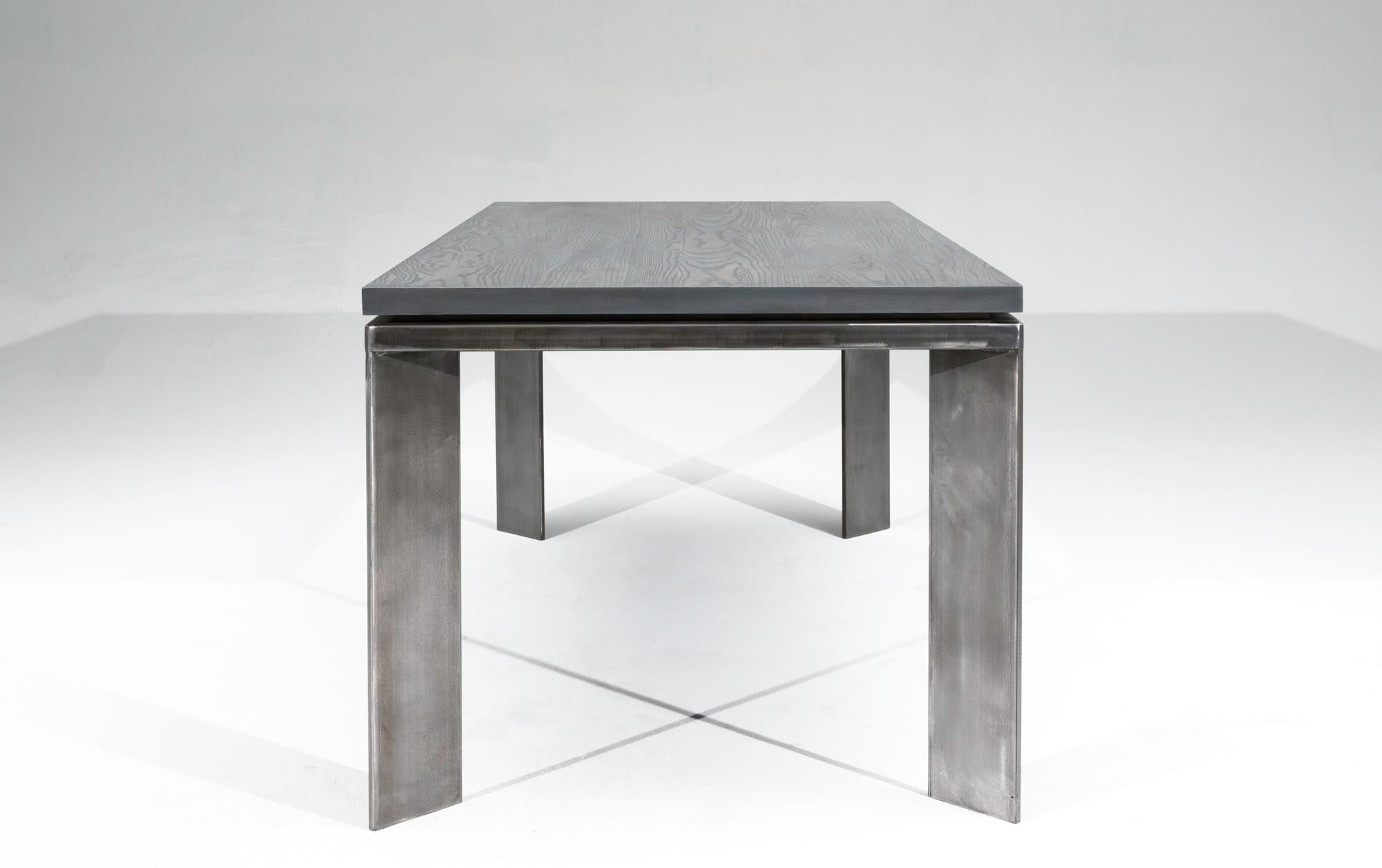 https://a.1stdibscdn.com/slate-gray-ashwood-dining-table-on-brushed-steel-base-charlevoix-dining-table-for-sale-picture-4/f_47361/1563050729774/Silver_002_master.jpg