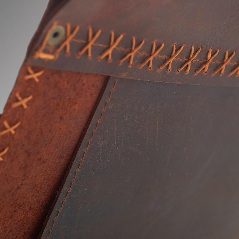 https://a.1stdibscdn.com/sling-oil-tanned-leather-brown-for-sale-picture-7/f_32773/f_214387821610186730171/Sling_chair_Texan_OIL_detail_grey_5_master.jpg?width=768