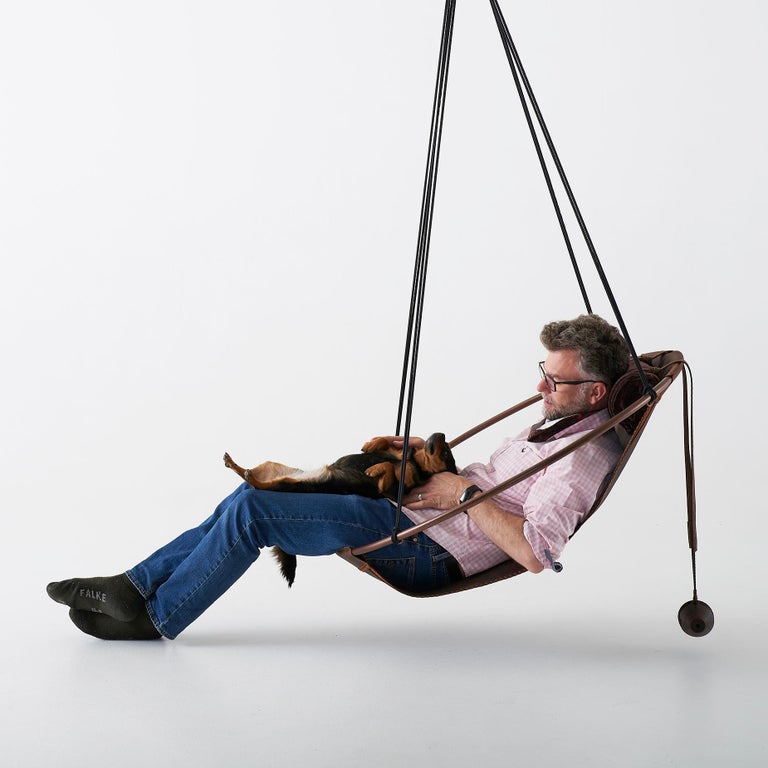 https://a.1stdibscdn.com/sling-oil-tanned-leather-brown-for-sale-picture-13/f_32773/f_214387821610186741150/Sling_chair_Texan_OIL_model_man_4_master.jpg?width=768