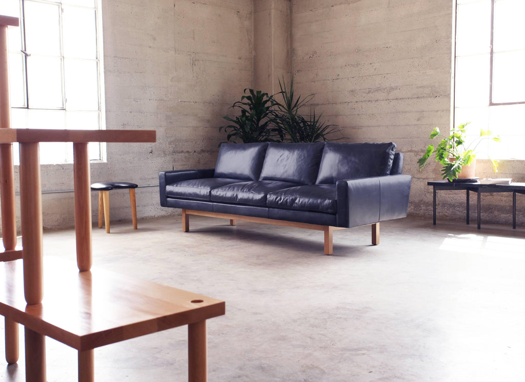 https://a.1stdibscdn.com/contemporary-x-large-standard-sofa-in-caramel-leather-with-walnut-base-for-sale-picture-8/f_29663/f_196154721593055605181/Standard_Sofa_Navy_Studio_master.jpg