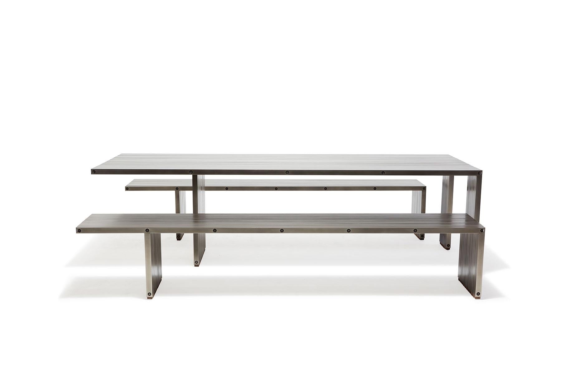 https://a.1stdibscdn.com/aluminum-compression-table-in-antique-nickel-for-sale-picture-3/f_24923/f_309951121666643858822/StephenKenn_AntiqueNickel_CompressionDiningSet_2019_03_web_master.jpg
