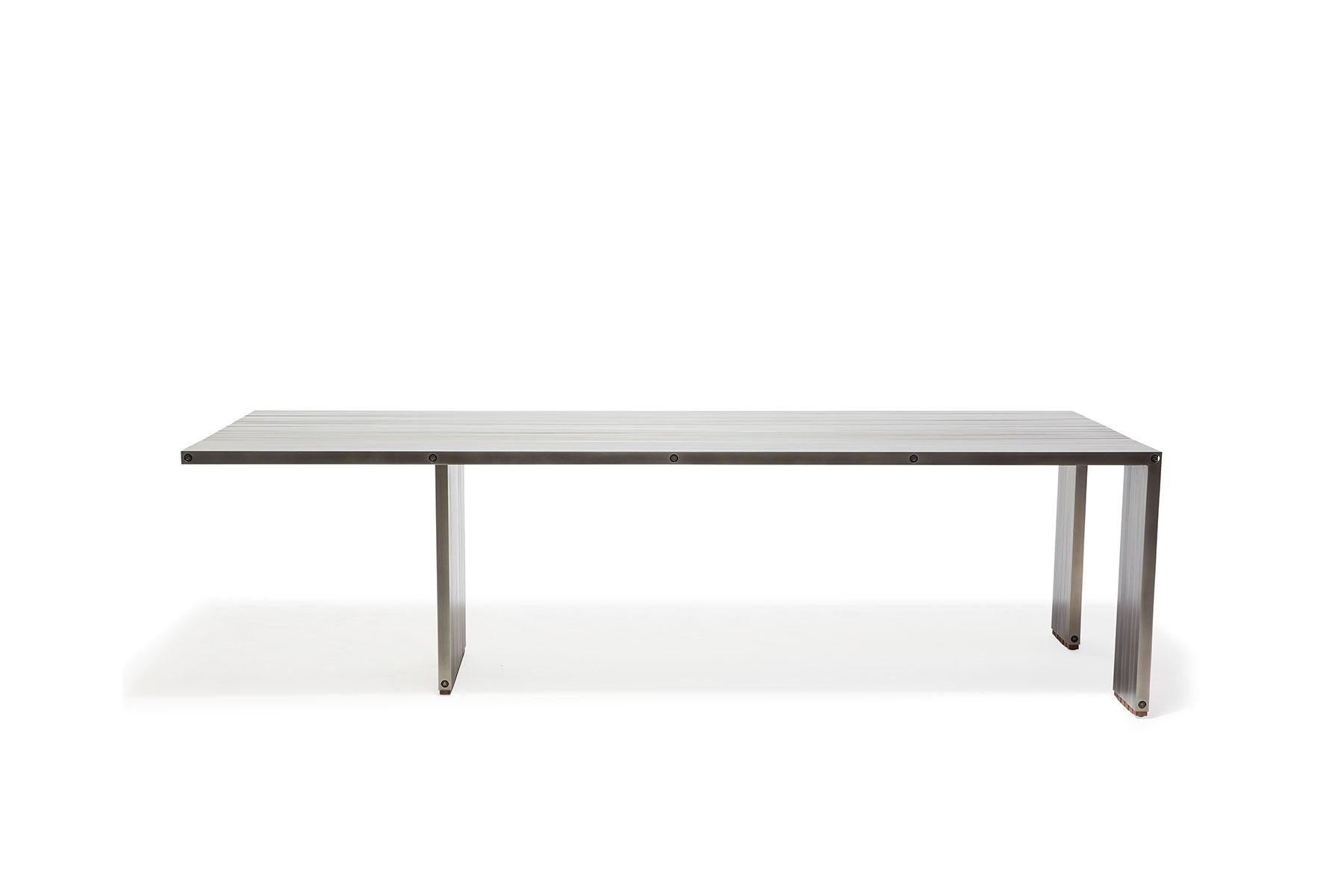 https://a.1stdibscdn.com/aluminum-compression-table-in-antique-nickel-for-sale-picture-4/f_24923/f_309951121666643867201/StephenKenn_AntiqueNickel_CompressionDiningTable_2019_02_web_master.jpg