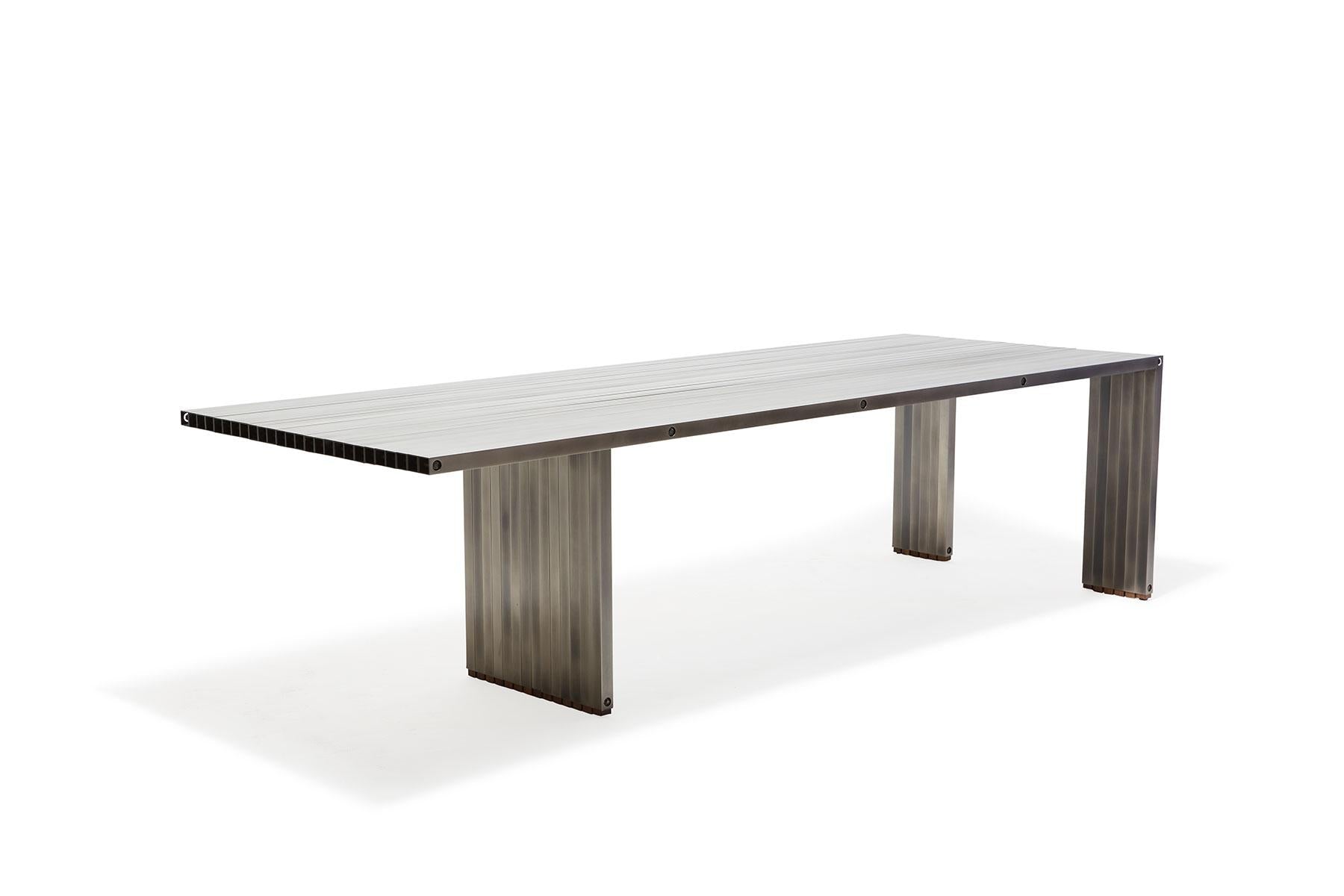 https://a.1stdibscdn.com/aluminum-compression-table-in-antique-nickel-for-sale-picture-5/f_24923/f_309951121666643867416/StephenKenn_AntiqueNickel_CompressionDiningTable_2019_03_web_master.jpg