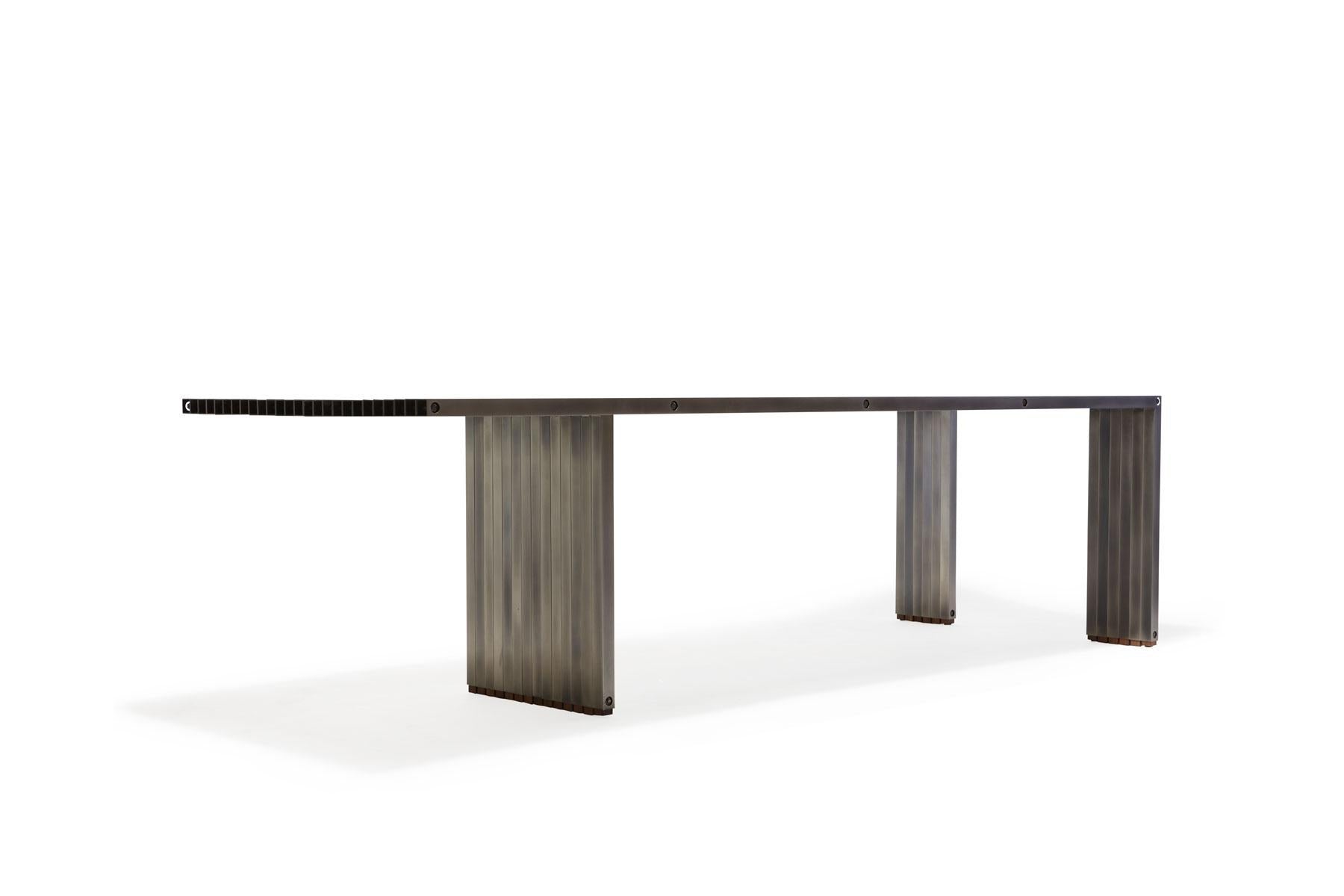 https://a.1stdibscdn.com/aluminum-compression-table-in-antique-nickel-for-sale-picture-6/f_24923/f_309951121666643867312/StephenKenn_AntiqueNickel_CompressionDiningTable_2019_04_web_master.jpg