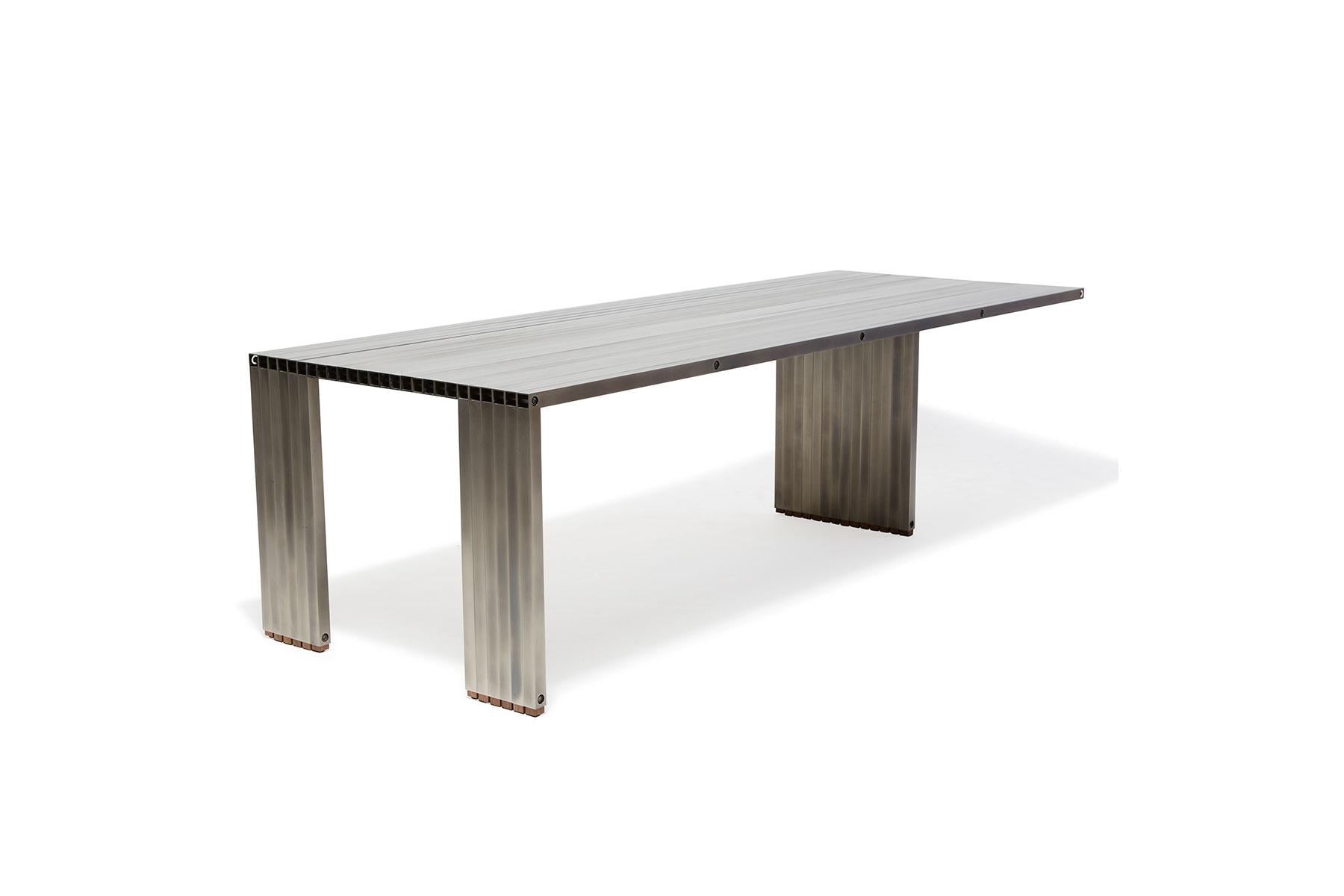 https://a.1stdibscdn.com/aluminum-compression-table-in-antique-nickel-for-sale-picture-7/f_24923/f_309951121666643867663/StephenKenn_AntiqueNickel_CompressionDiningTable_2019_05_web_master.jpg