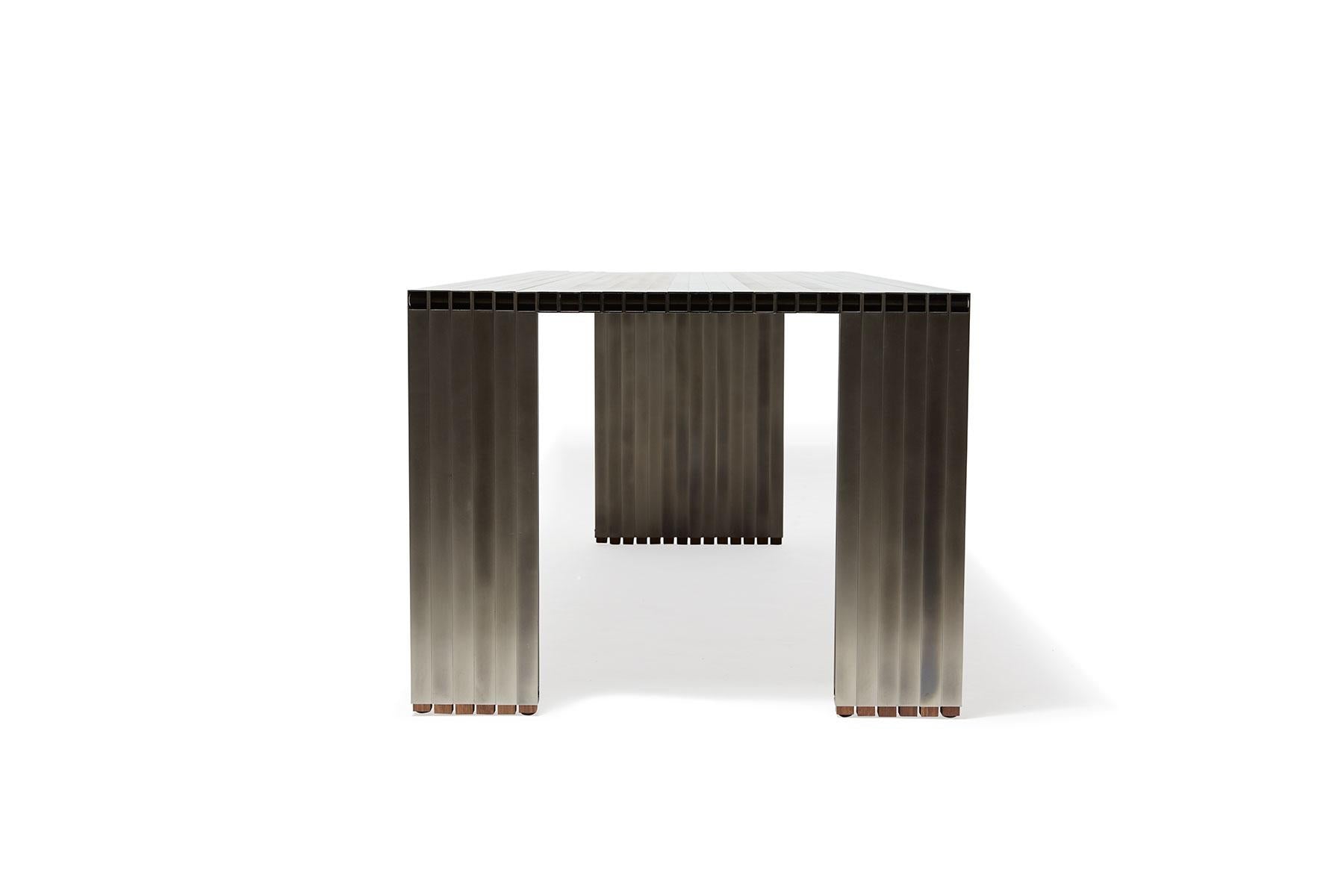 https://a.1stdibscdn.com/aluminum-compression-table-in-antique-nickel-for-sale-picture-9/f_24923/f_309951121666643867764/StephenKenn_AntiqueNickel_CompressionDiningTable_2019_07_web_master.jpg