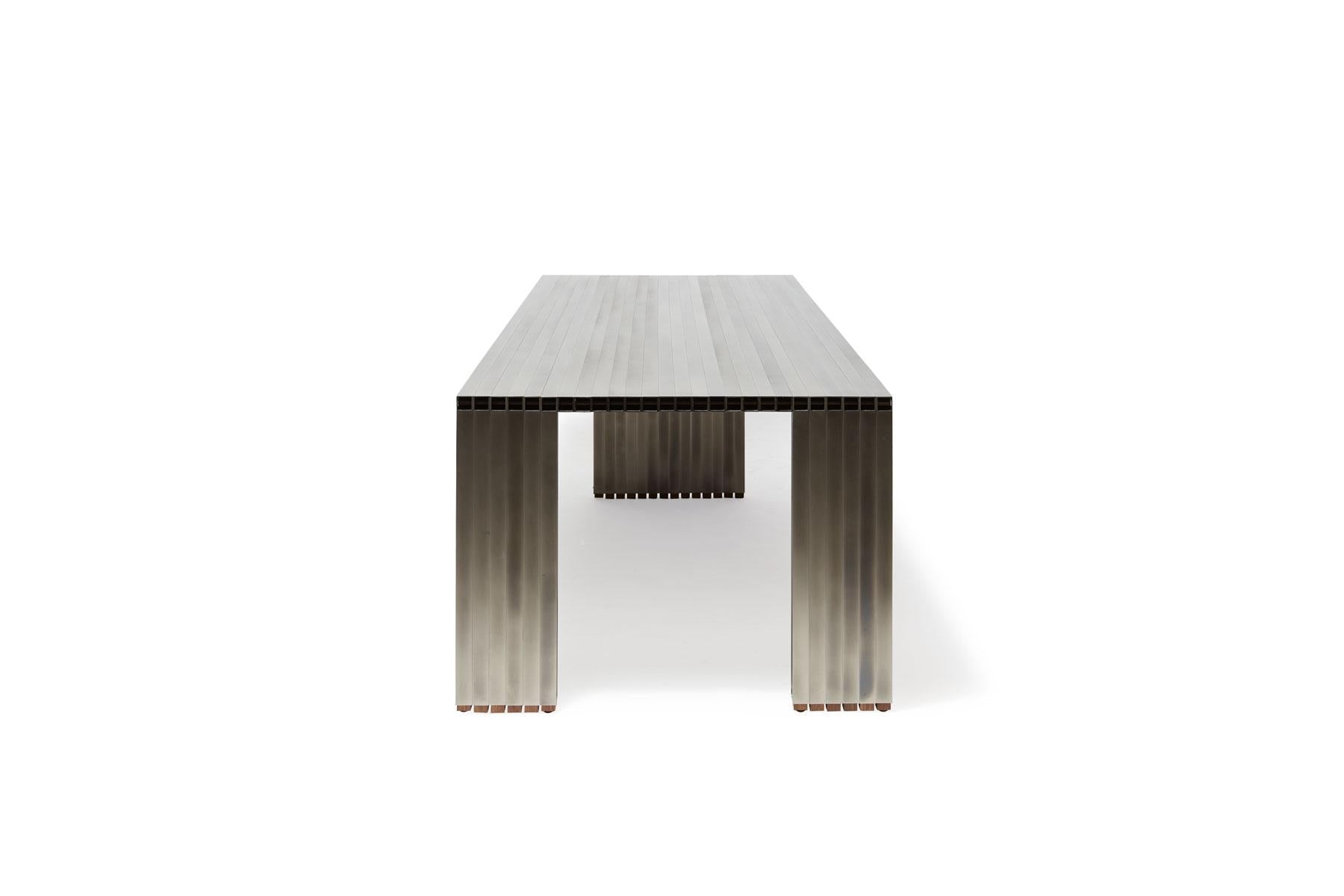 https://a.1stdibscdn.com/aluminum-compression-table-in-antique-nickel-for-sale-picture-10/f_24923/f_309951121666643867695/StephenKenn_AntiqueNickel_CompressionDiningTable_2019_08_web_master.jpg