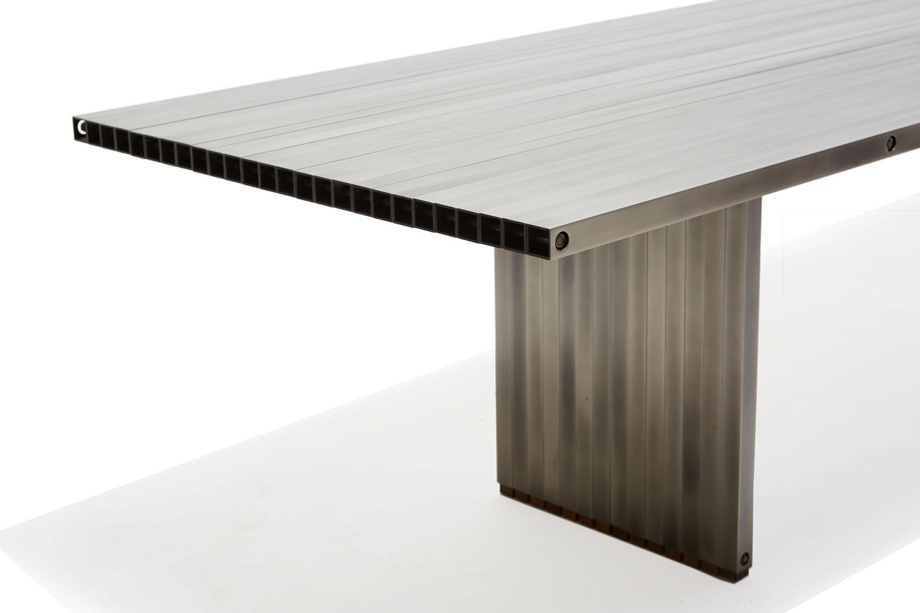 https://a.1stdibscdn.com/aluminum-compression-table-in-antique-nickel-for-sale-picture-11/f_24923/f_309951121666643867814/StephenKenn_AntiqueNickel_CompressionDiningTable_2019_09_web_master.jpg