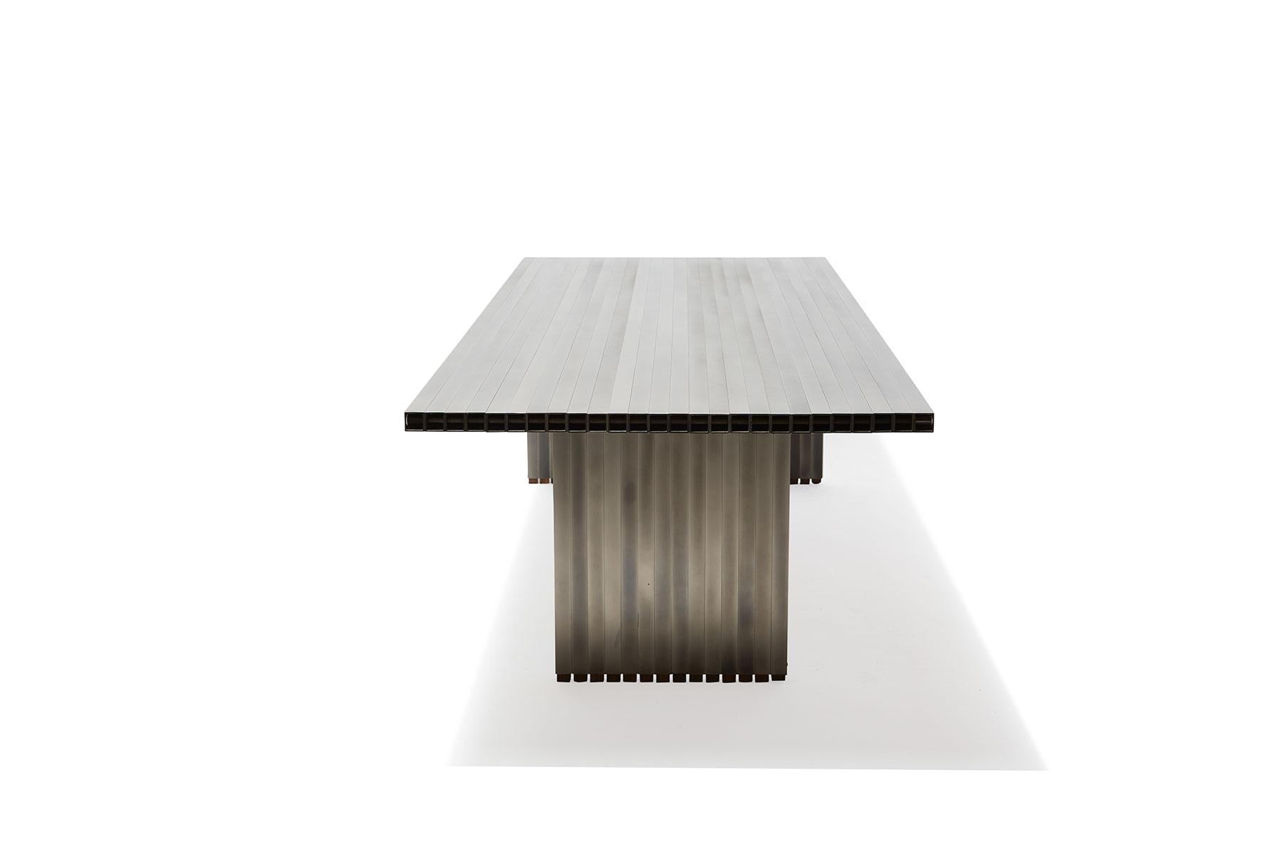 https://a.1stdibscdn.com/aluminum-compression-table-in-antique-nickel-for-sale-picture-12/f_24923/f_309951121666643867732/StephenKenn_AntiqueNickel_CompressionDiningTable_2019_10_web_master.jpg