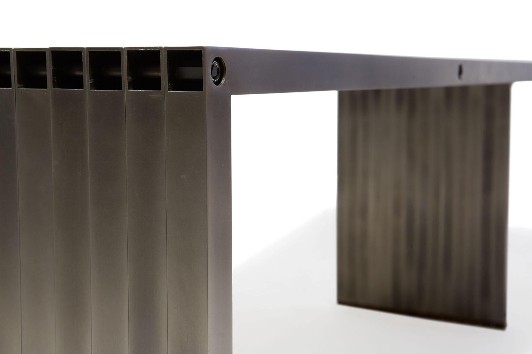 https://a.1stdibscdn.com/aluminum-compression-table-in-antique-nickel-for-sale-picture-14/f_24923/f_309951121666643868056/StephenKenn_AntiqueNickel_CompressionDiningTable_2019_12_web_master.jpg