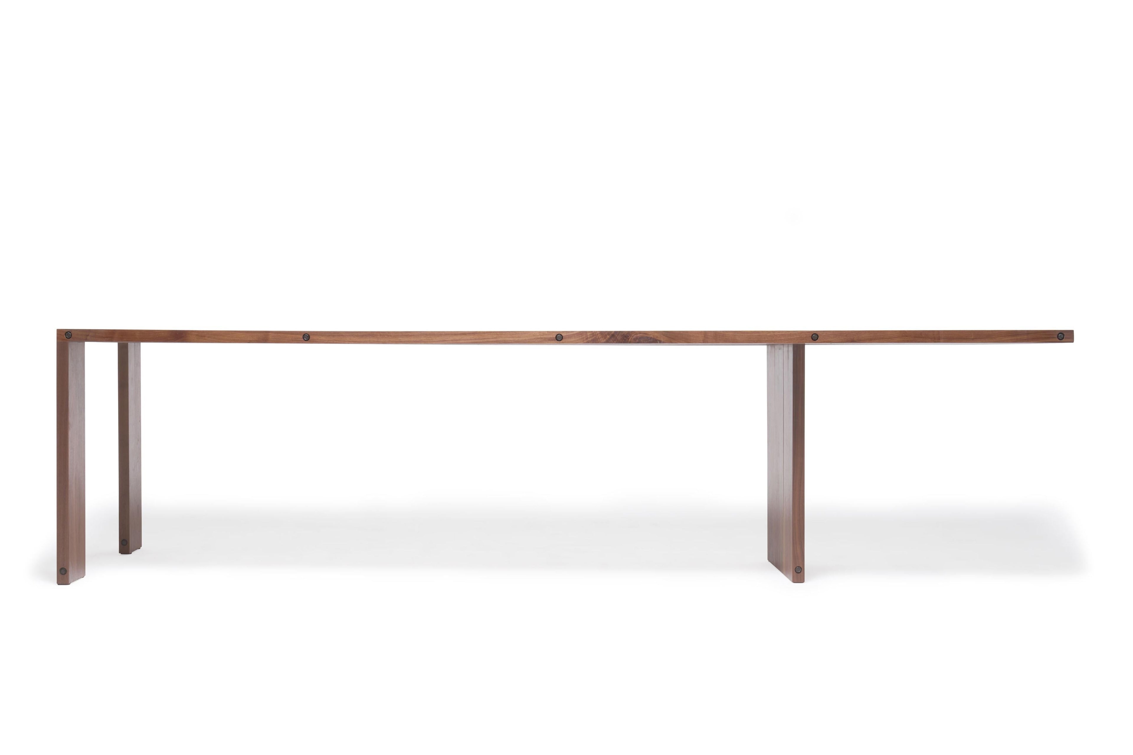 https://a.1stdibscdn.com/compression-dining-table-in-walnut-wood-for-sale-picture-4/f_24923/f_309954621666646941502/StephenKenn_CompressionTable_Walnut_04_web_master.jpg