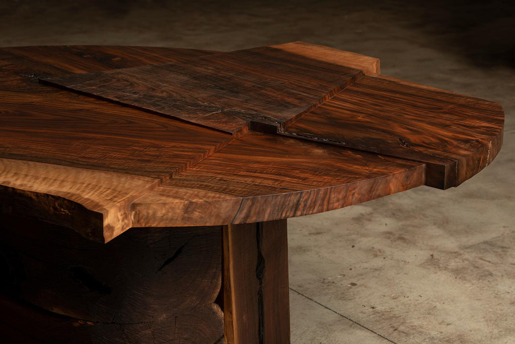 https://a.1stdibscdn.com/claro-walnut-single-slab-strike-slip-round-dining-table-for-sale-picture-6/f_23463/1613606007792/Strike_Slip_Round_VI_Top_Corner_Front_Detail_R_master.jpg