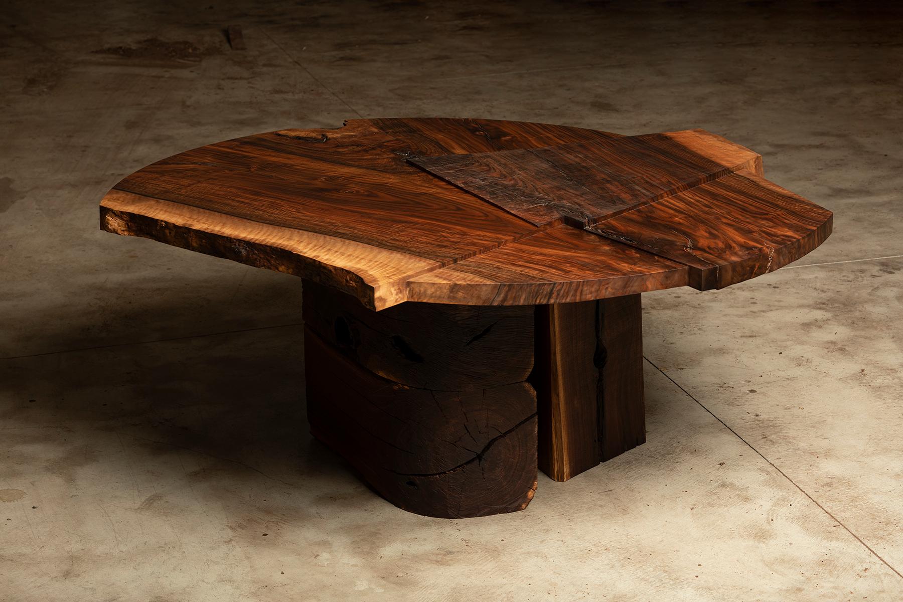 https://a.1stdibscdn.com/claro-walnut-single-slab-strike-slip-round-dining-table-for-sale-picture-5/f_23463/1613606006691/Strike_Slip_Round_VI_Top_Corner_Front_Opt_R_master.jpg